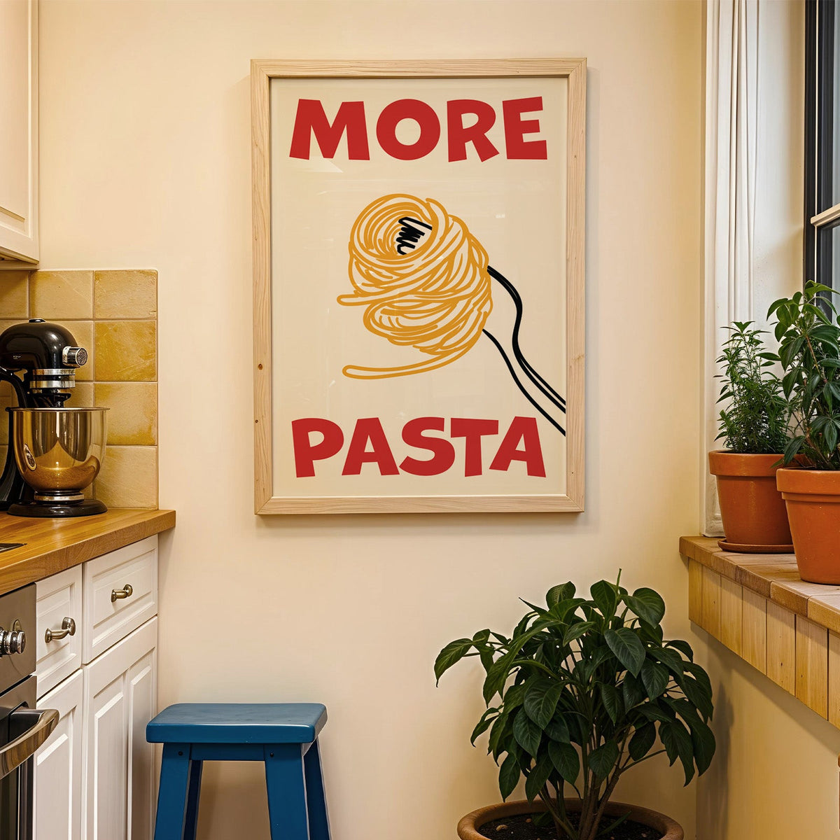 More pasta spaghetti print in a wood frame on a yellow tiled kitchen wall