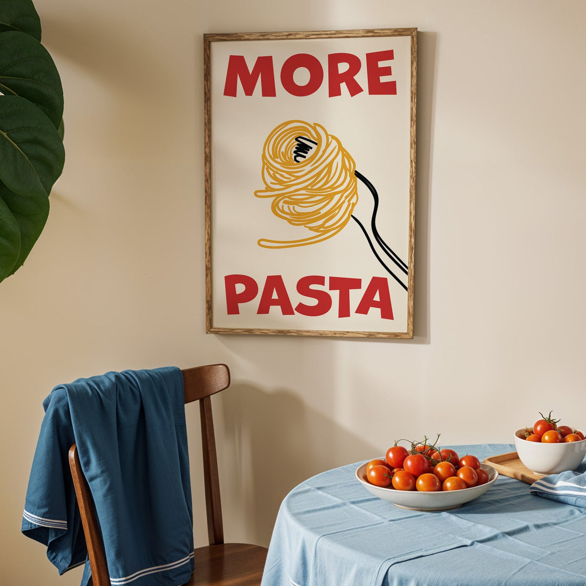 More pasta spaghetti print in an oak frame above a blue linen table with ripe tomatoes