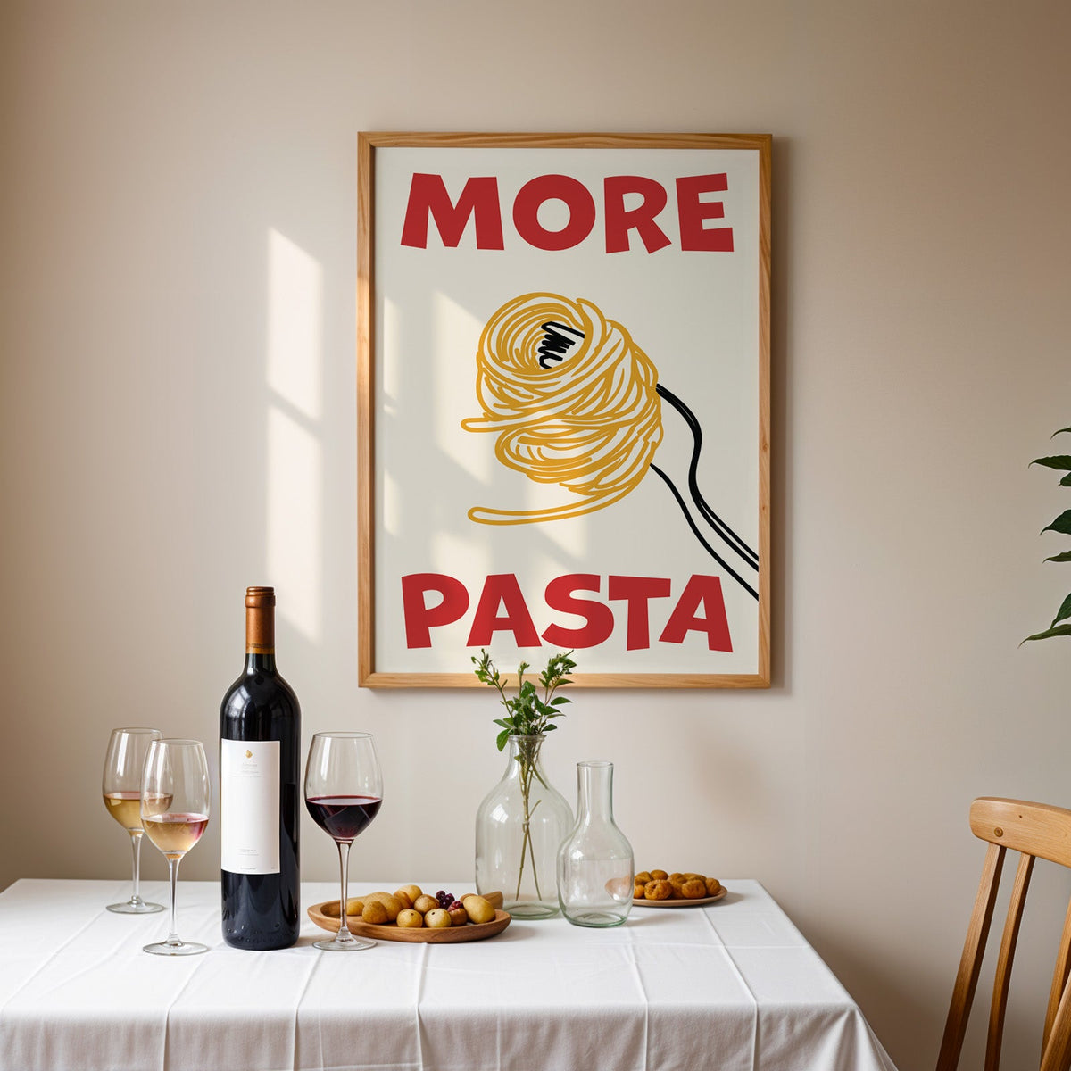 More pasta spaghetti print in an oak frame above a table laid with red wine and glasses