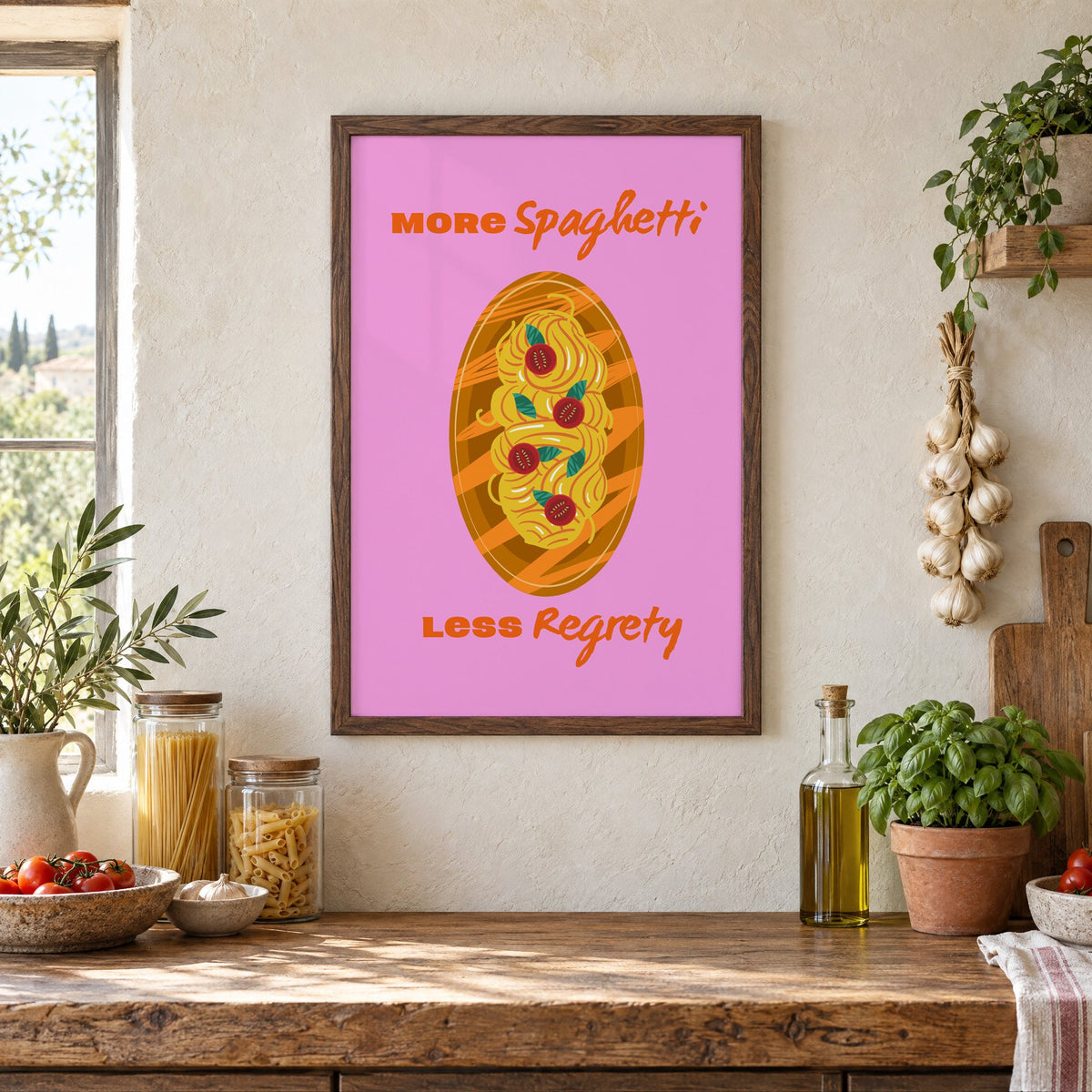 MORE Spaghetti LESS Regrety pasta plate print in a walnut frame above a rustic Italian pantry counter with pasta jars, garlic and tomatoes
