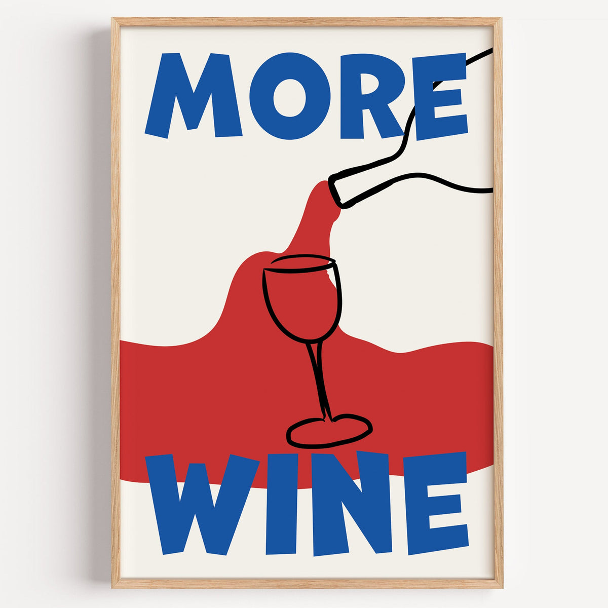 More wine red pour print in a light oak frame on a plain white wall