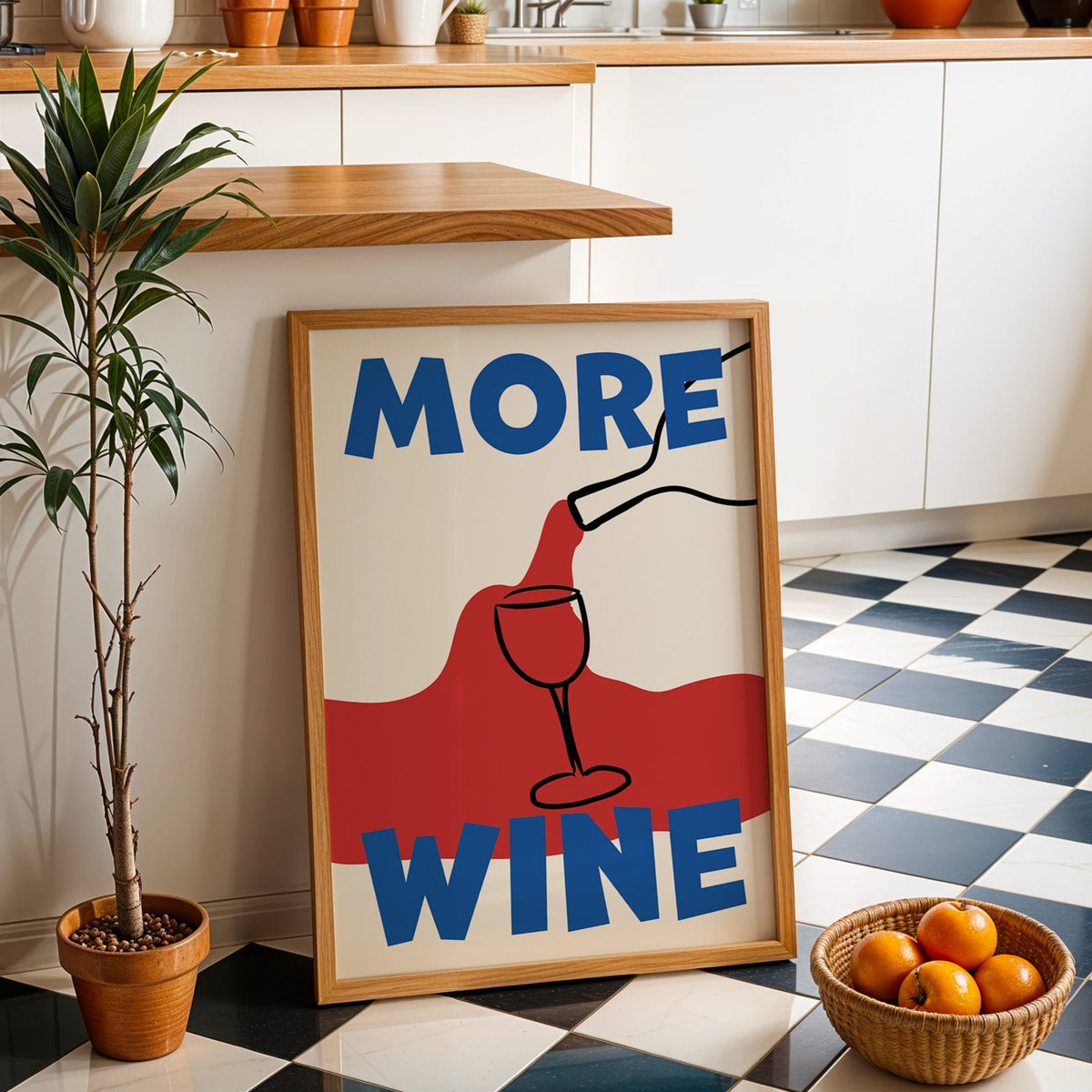 More wine red pour print in an oak frame by a kitchen island and checkered floor