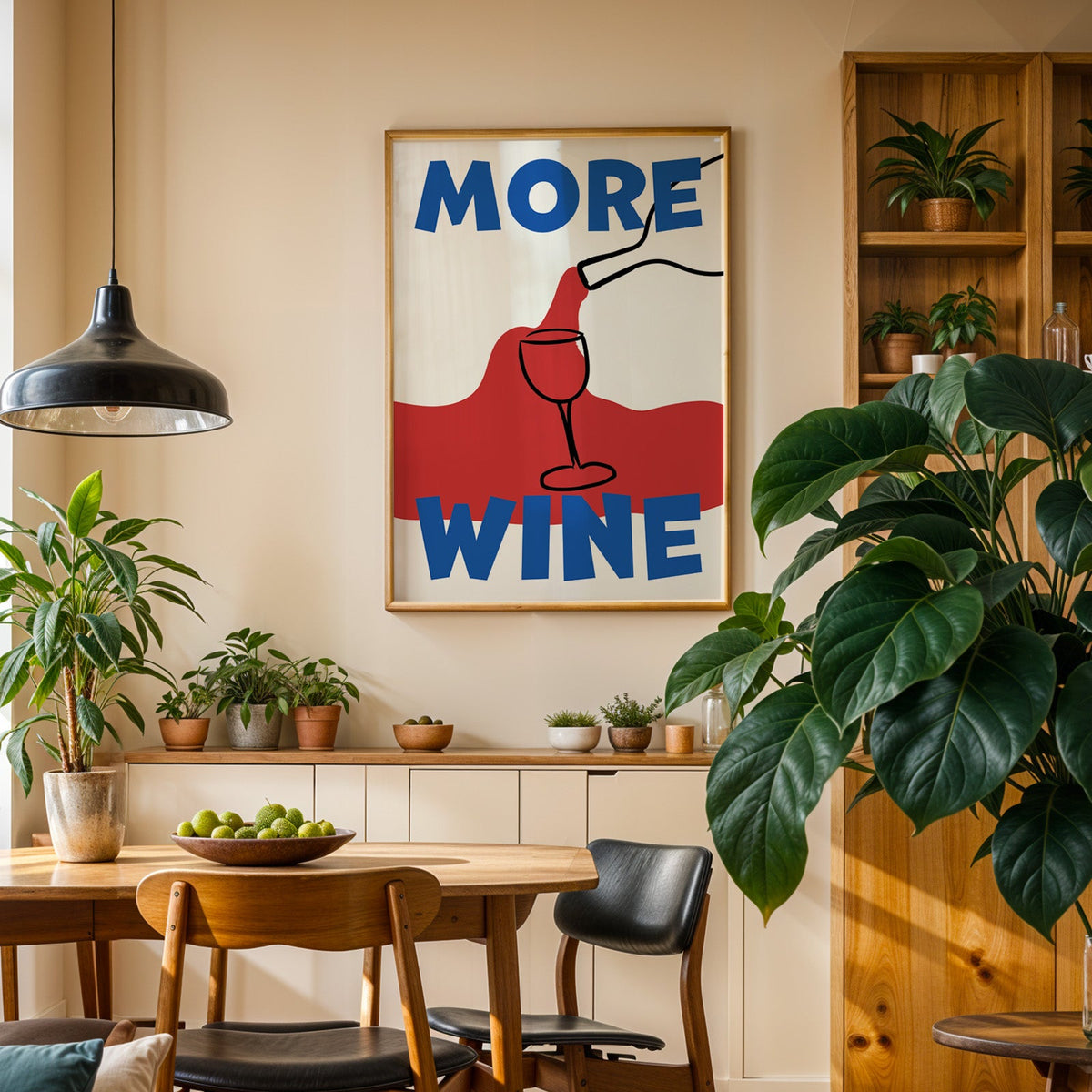 More wine red pour print in an oak frame above a sideboard in a plant-filled dining room