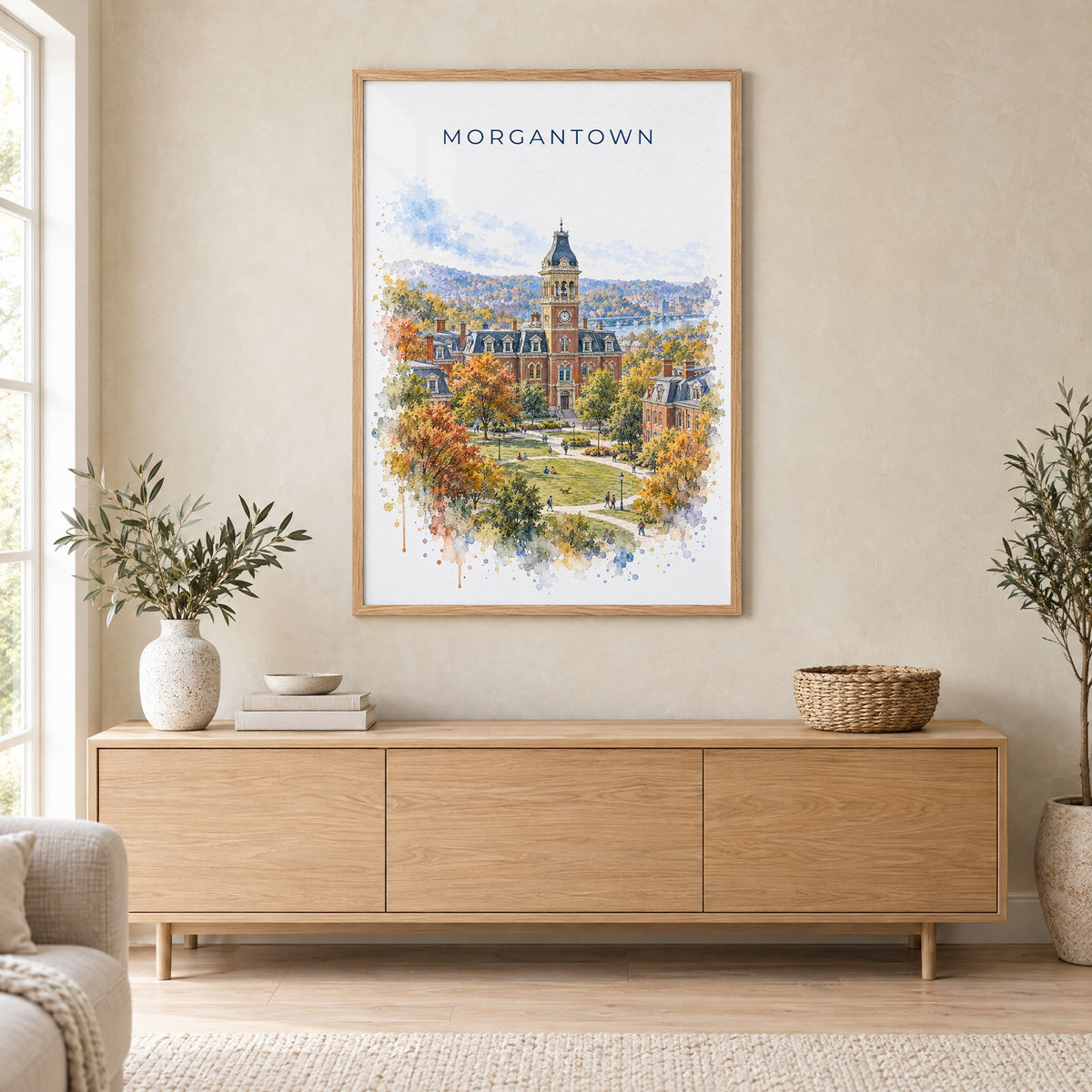 Morgantown watercolor print in an oak frame above a light wood sideboard in a Scandinavian living room