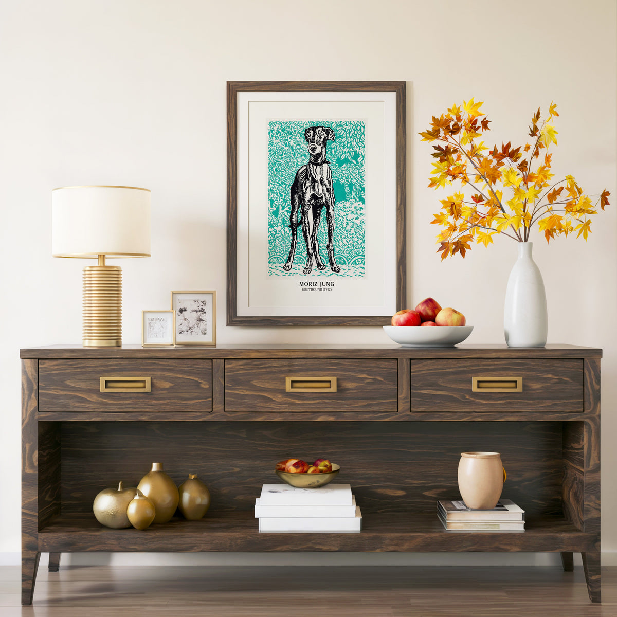 Moriz Jung Greyhound print in a walnut frame above a console with branches