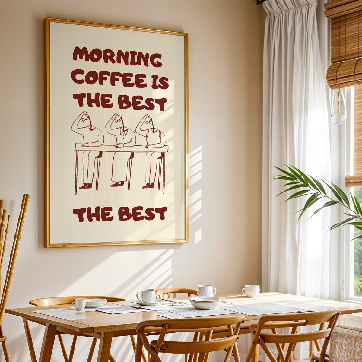 Morning Coffee Is The Best print shown in a gold frame above a breakfast table by a curtained window