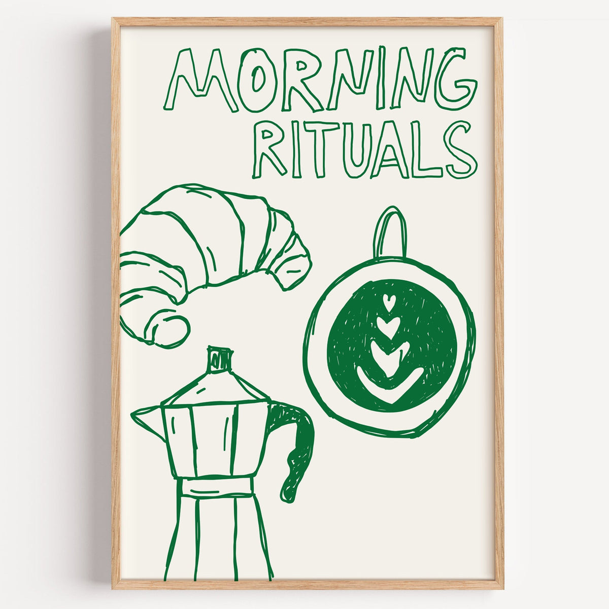 Morning rituals coffee line print in a light oak frame on a plain white wall