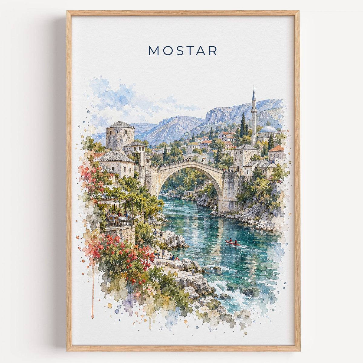 Mostar watercolor print in a light oak frame on a plain white wall