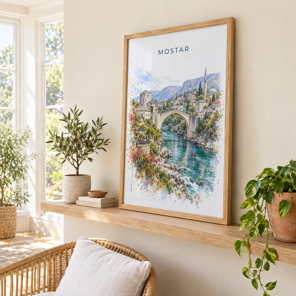 Mostar watercolor print in an oak frame on a picture ledge in a sunlit sunroom
