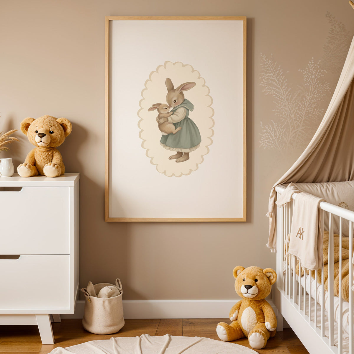 Mother rabbit in sage dress hugging baby bunny nursery print in an oak frame between a white dresser and a canopy crib
