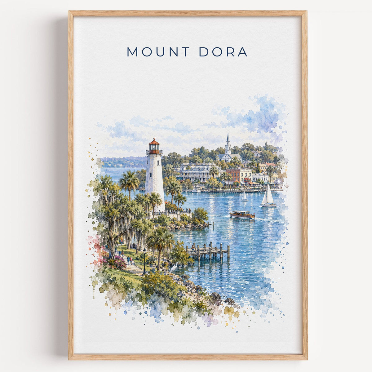 Mount Dora, Florida watercolor print in a light oak frame on a plain white wall