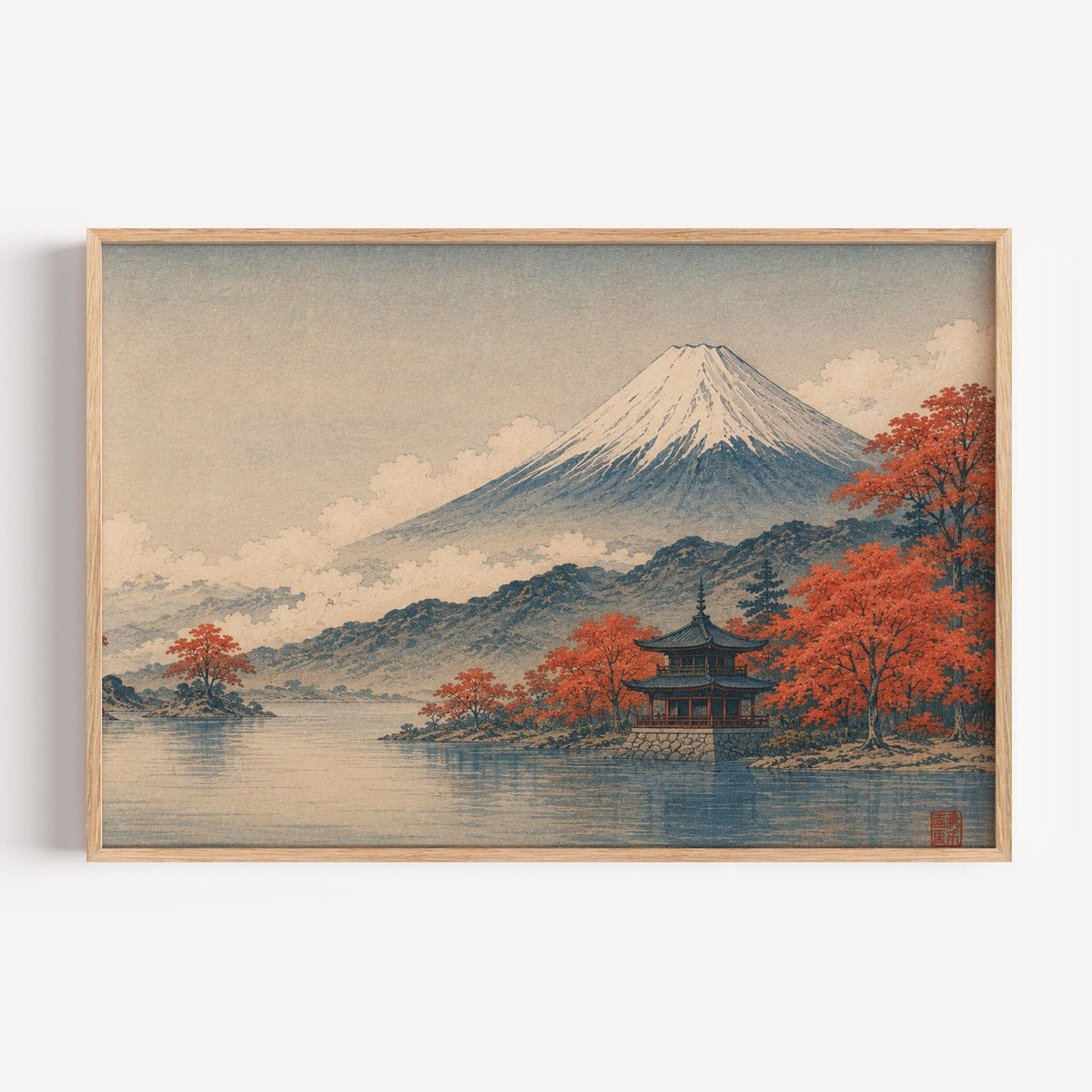 Mount Fuji autumn lake and pagoda print in a light oak frame on a plain white wall