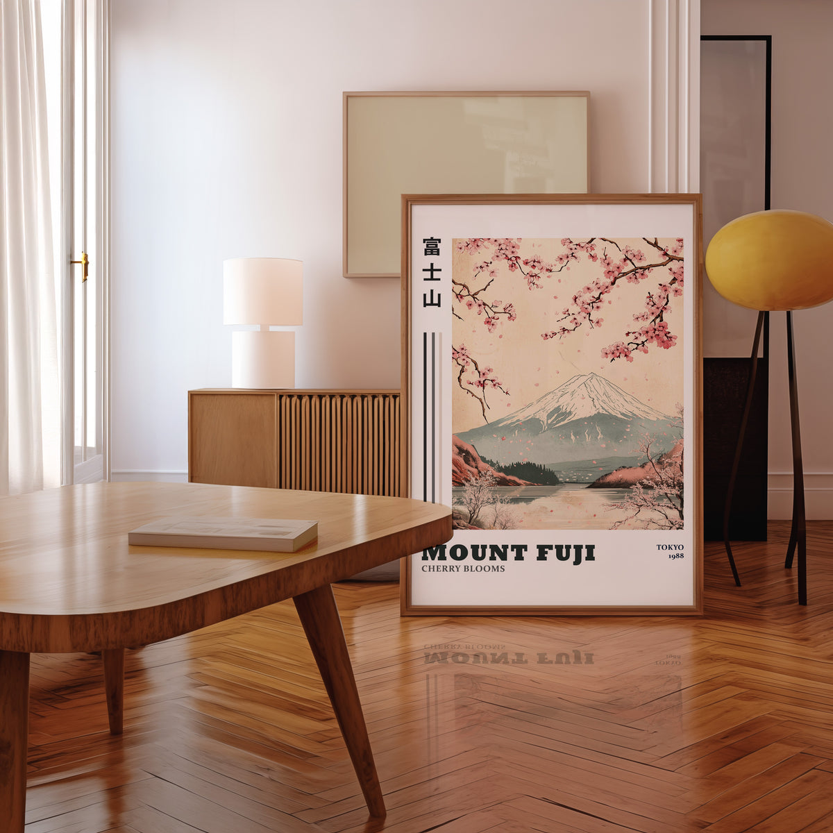 Mount Fuji cherry blooms lake print in a walnut frame leaning in a mid-century living room