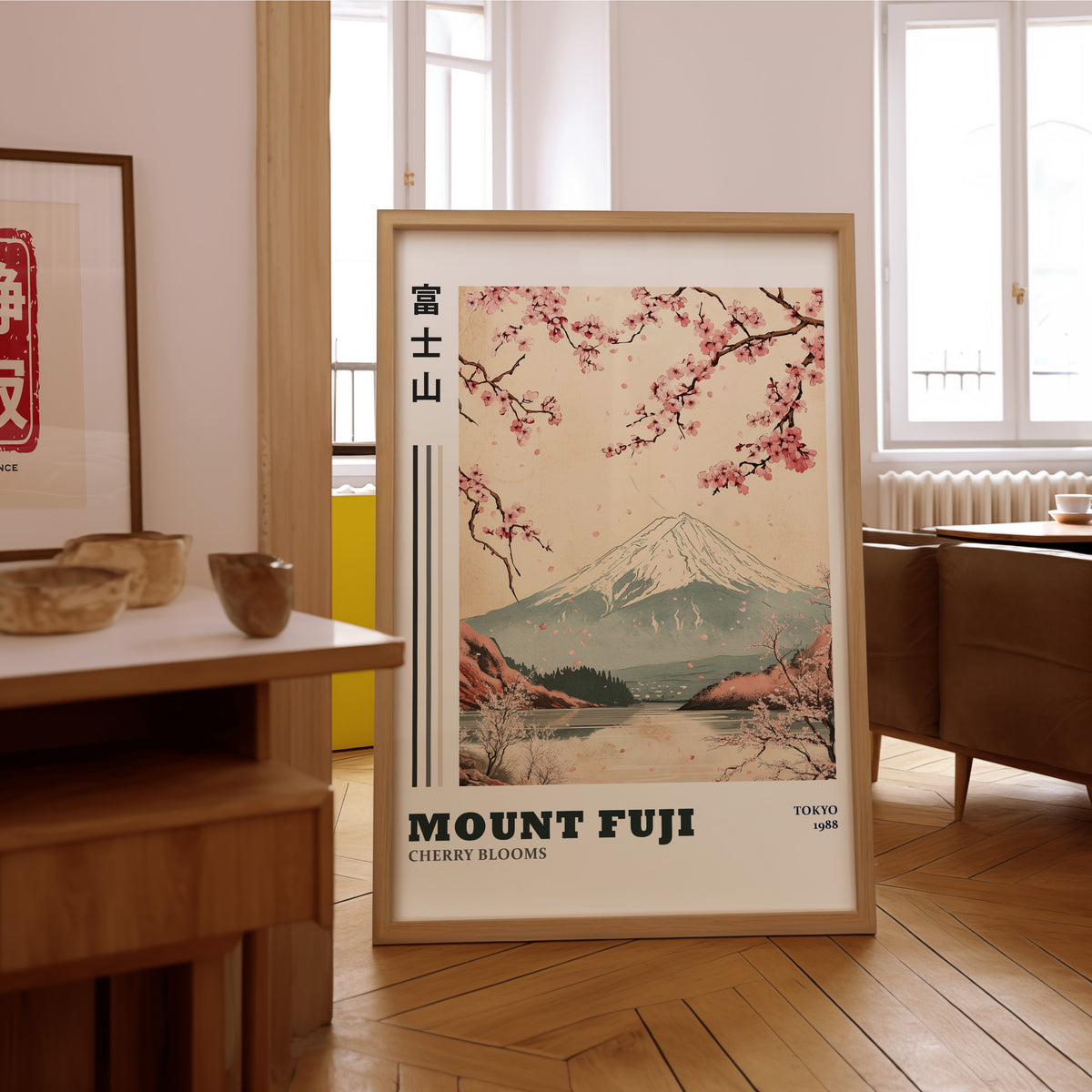 Mount Fuji cherry blooms lake print in an oak frame on the parquet floor of a sunlit living room