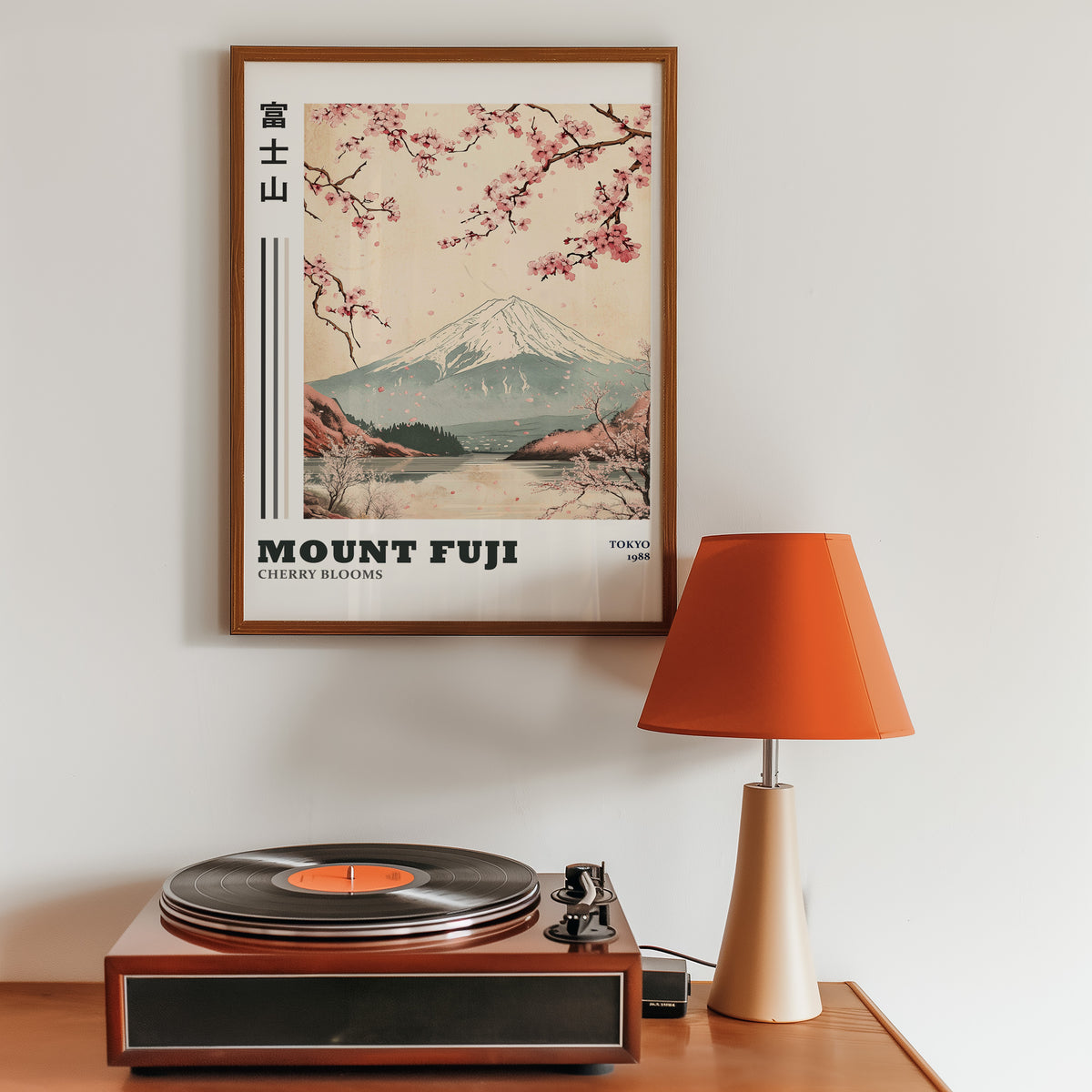 Mount Fuji cherry blooms lake print in a walnut frame above a sideboard with a record player