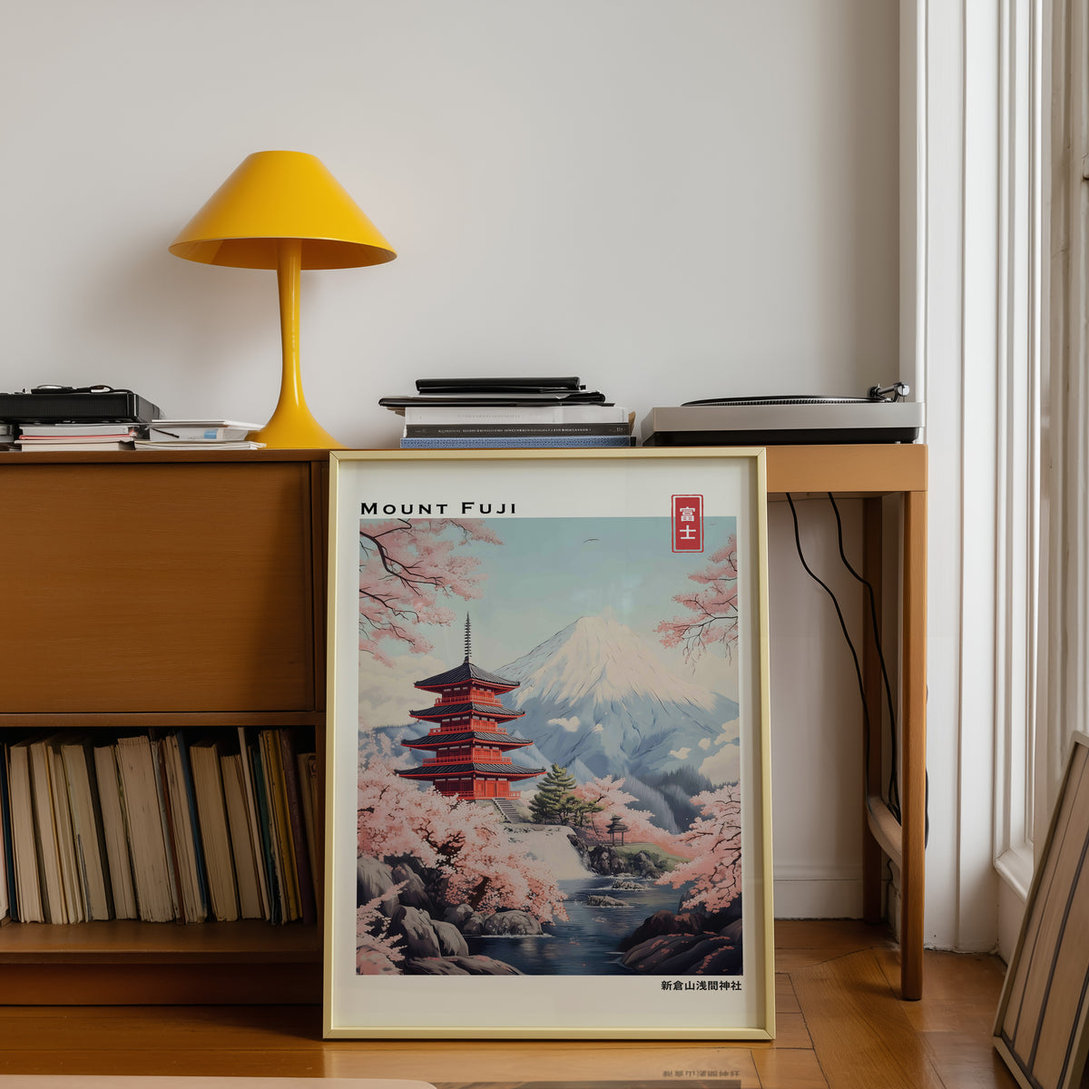 Pastel Chureito Pagoda and Fuji print shown in a gold frame below a teak desk with a yellow lamp