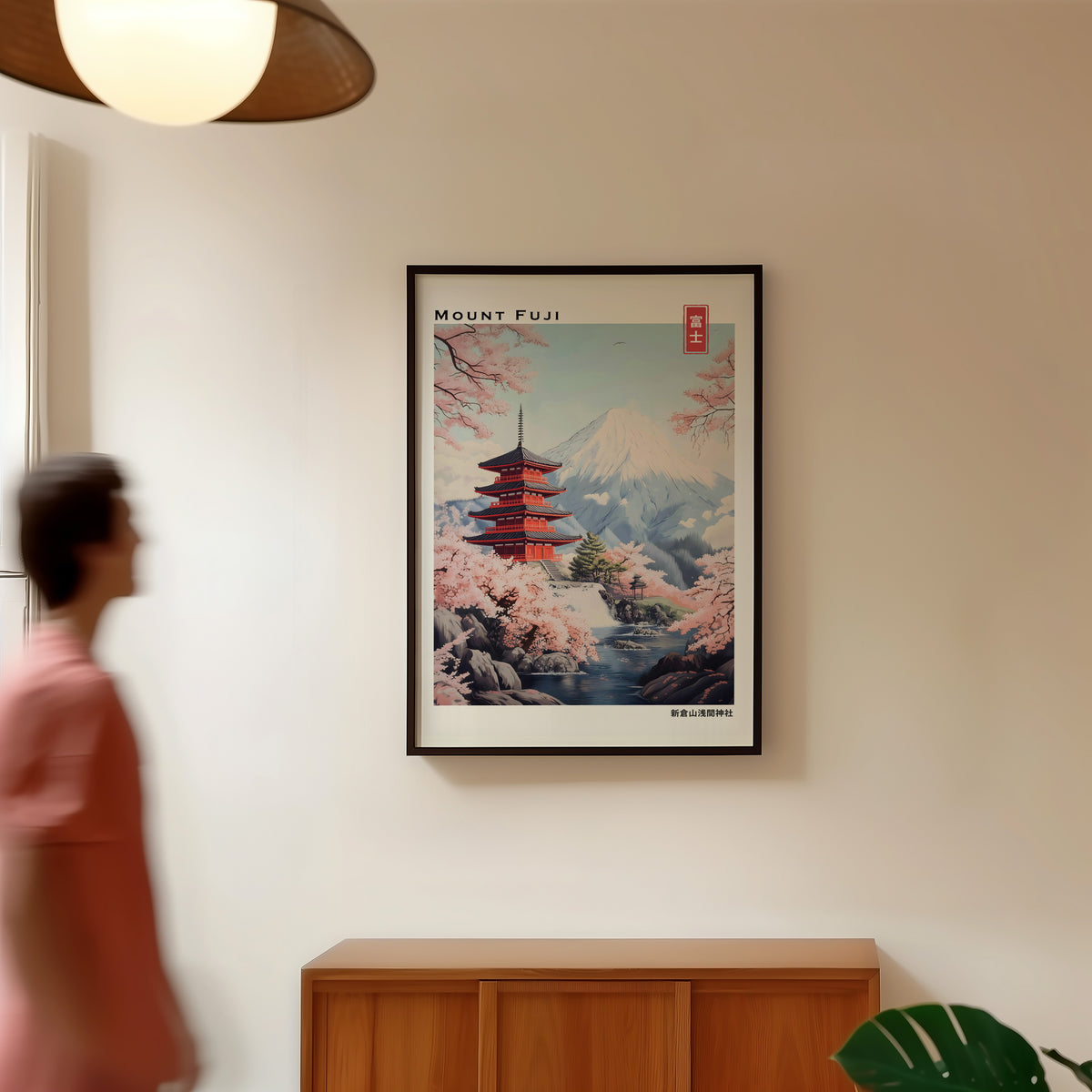 Pastel Chureito Pagoda and Fuji print in a black frame in a hallway under a rattan pendant