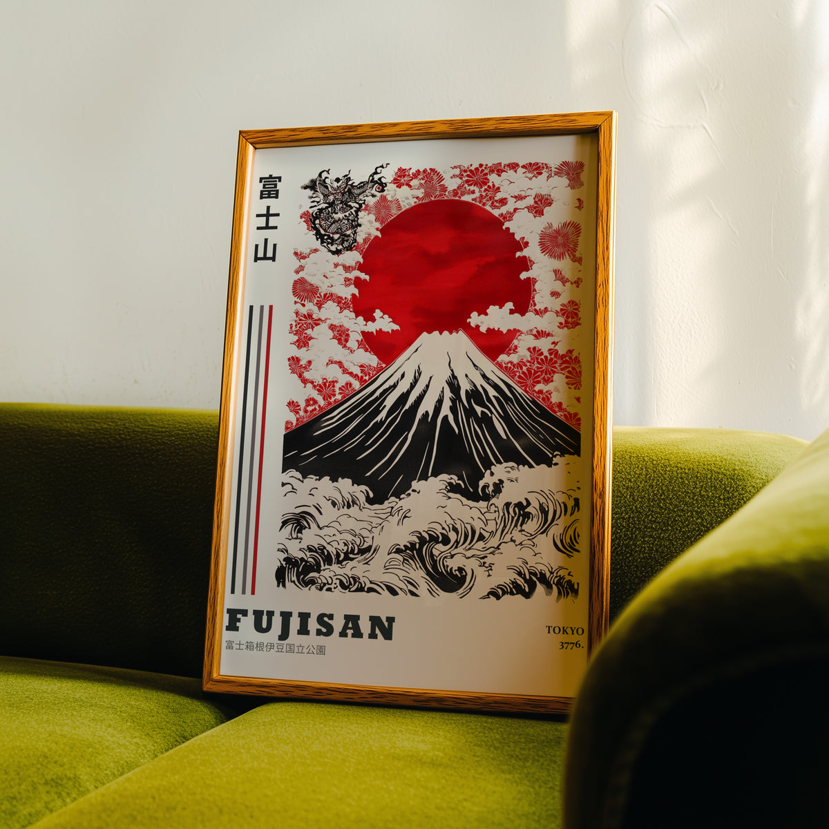 Red sun Mount Fuji floral wave print in an oak frame propped on a green velvet sofa