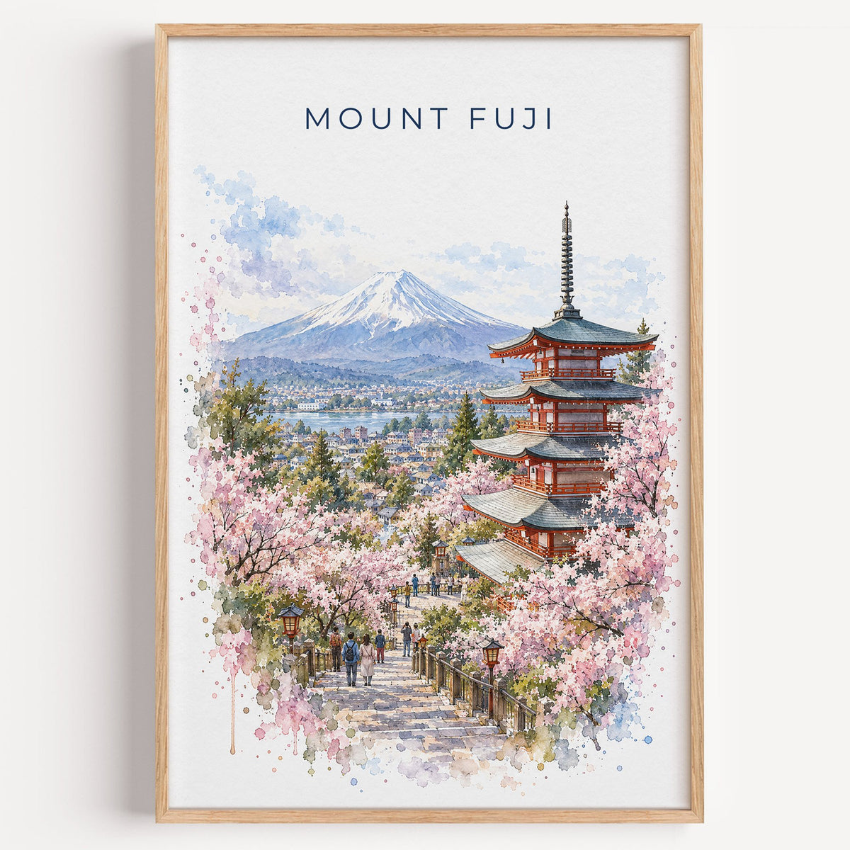 Mount Fuji watercolor print in a light oak frame on a plain white wall