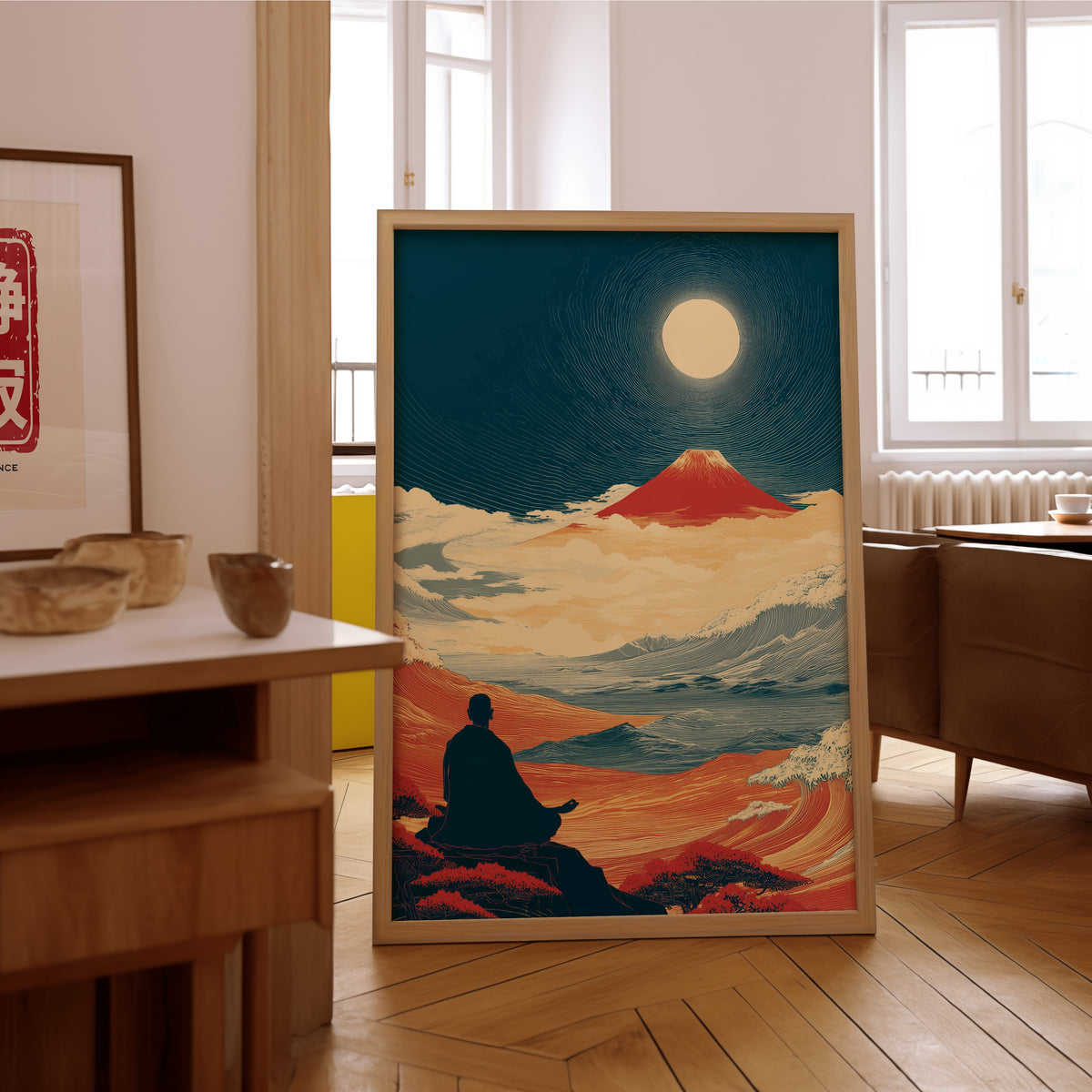 Meditating monk and red Fuji print in an oak frame on the parquet floor of a sunlit living room