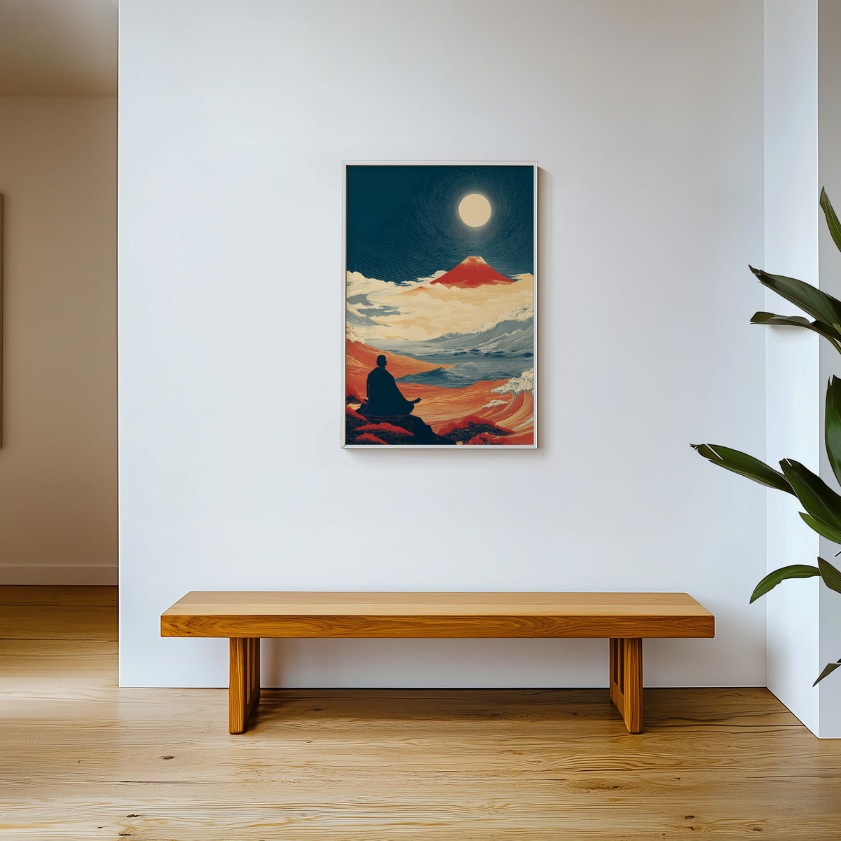 Meditating monk and red Fuji print shown in a white frame above a wooden entryway bench