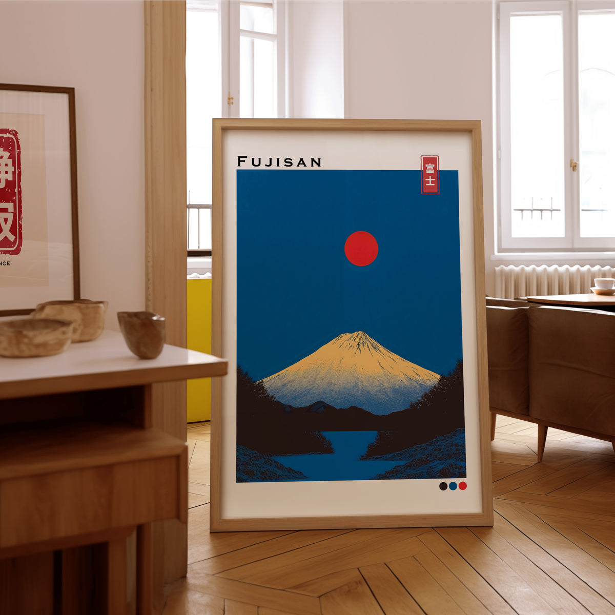 Minimal golden Mount Fuji print in an oak frame on the parquet floor of a sunlit living room