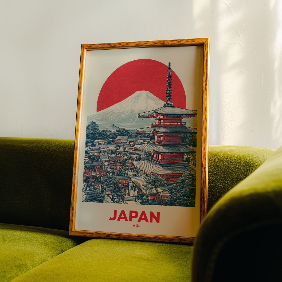 Retro Mount Fuji red pagoda print in an oak frame propped on a green velvet sofa