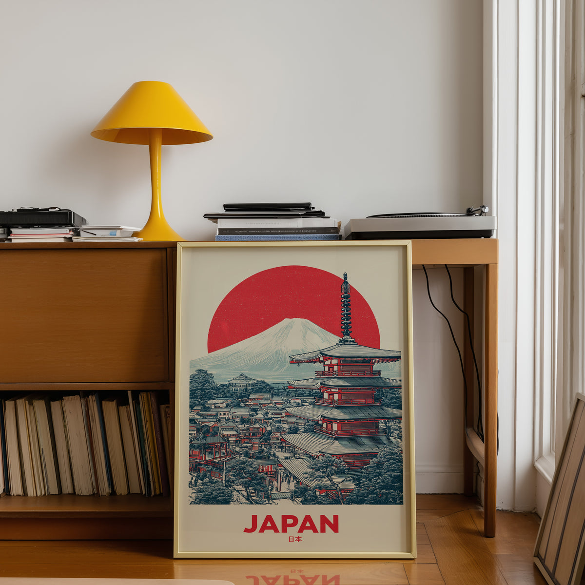 Retro Mount Fuji red pagoda print shown in a gold frame below a teak desk with a yellow lamp