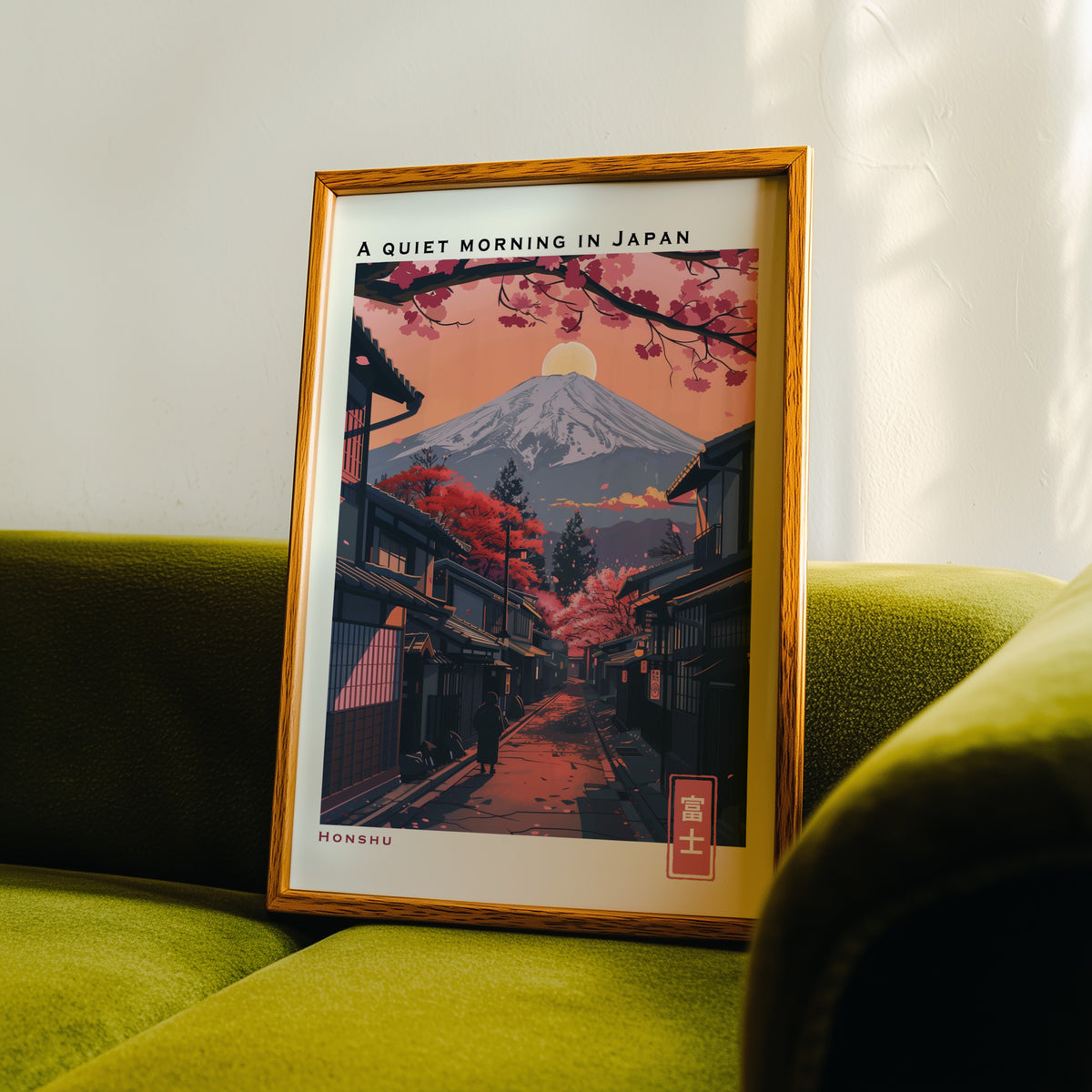 Quiet morning Fuji street print in an oak frame propped on a green velvet sofa
