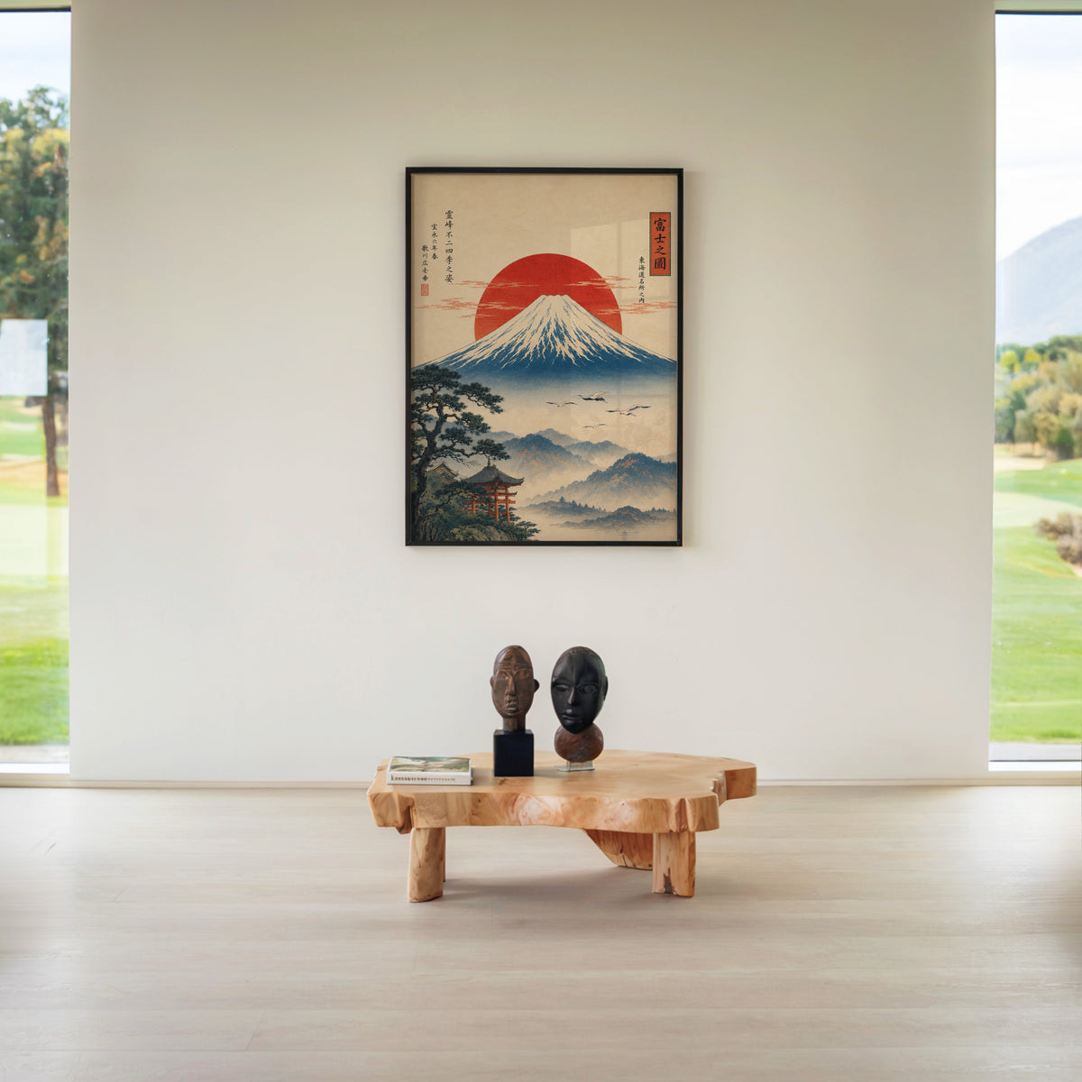 Mount Fuji with red sun and flying cranes print in a black frame above a live-edge wood coffee table between garden windows