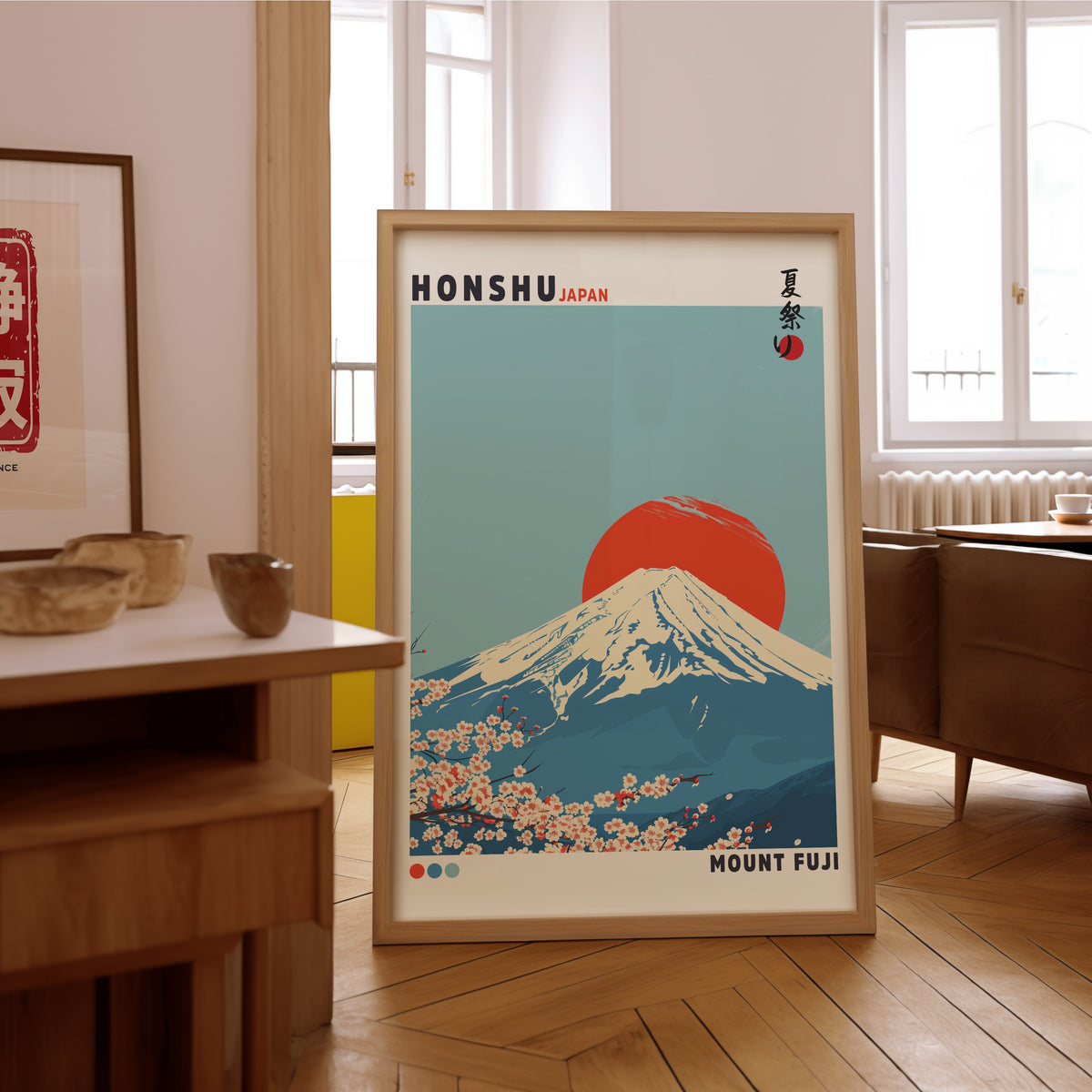 Mount Fuji red sun sakura print in an oak frame on the parquet floor of a sunlit living room