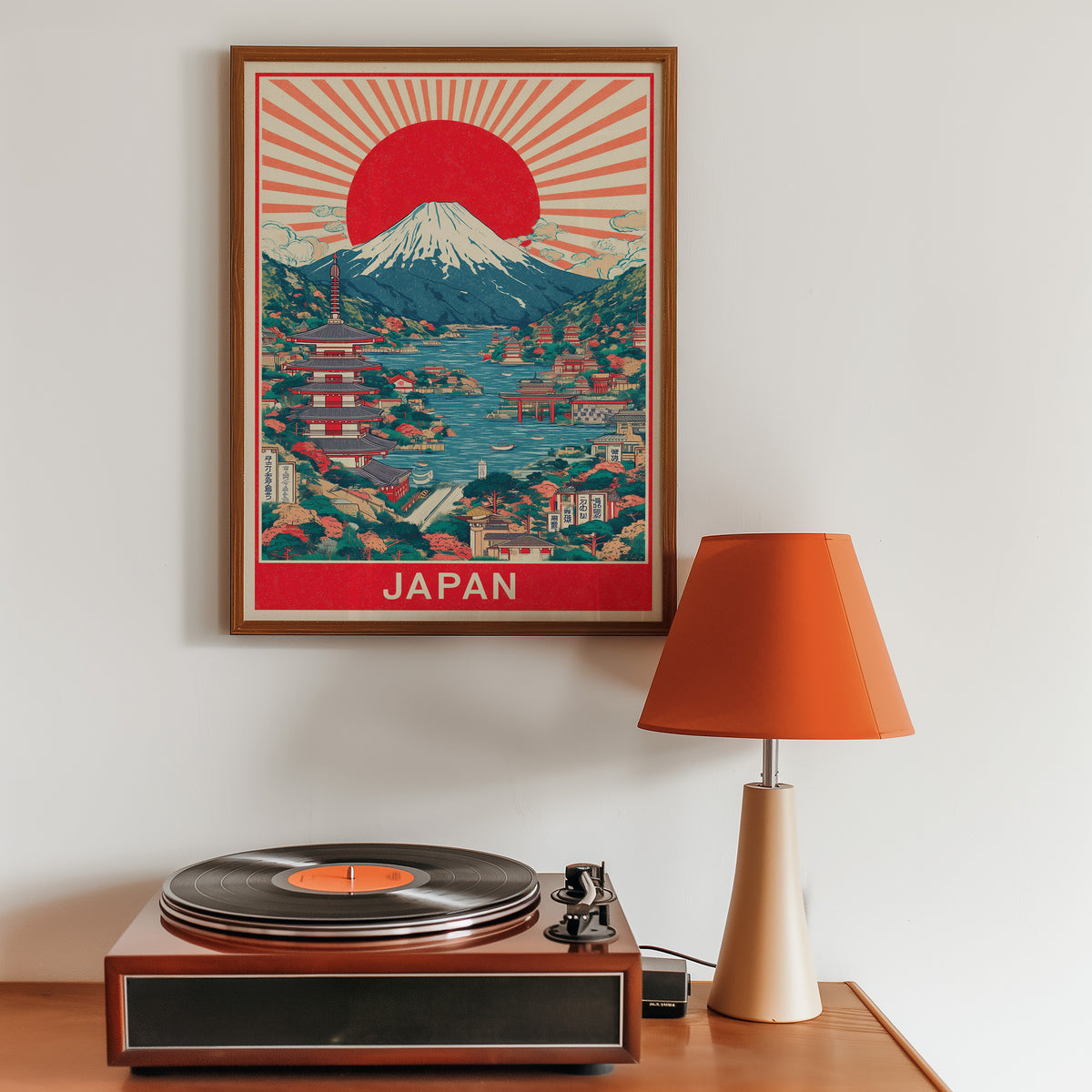 Mount Fuji sunburst lake print in a walnut frame above a sideboard with a record player