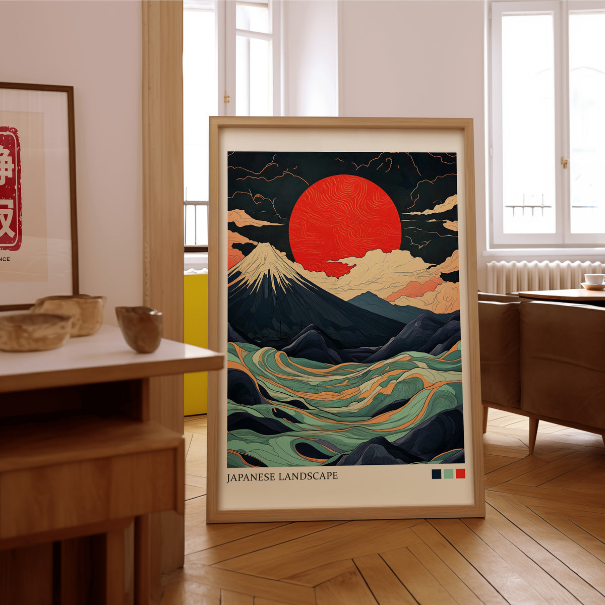 Fuji teal waves red sun print in an oak frame on the parquet floor of a sunlit living room
