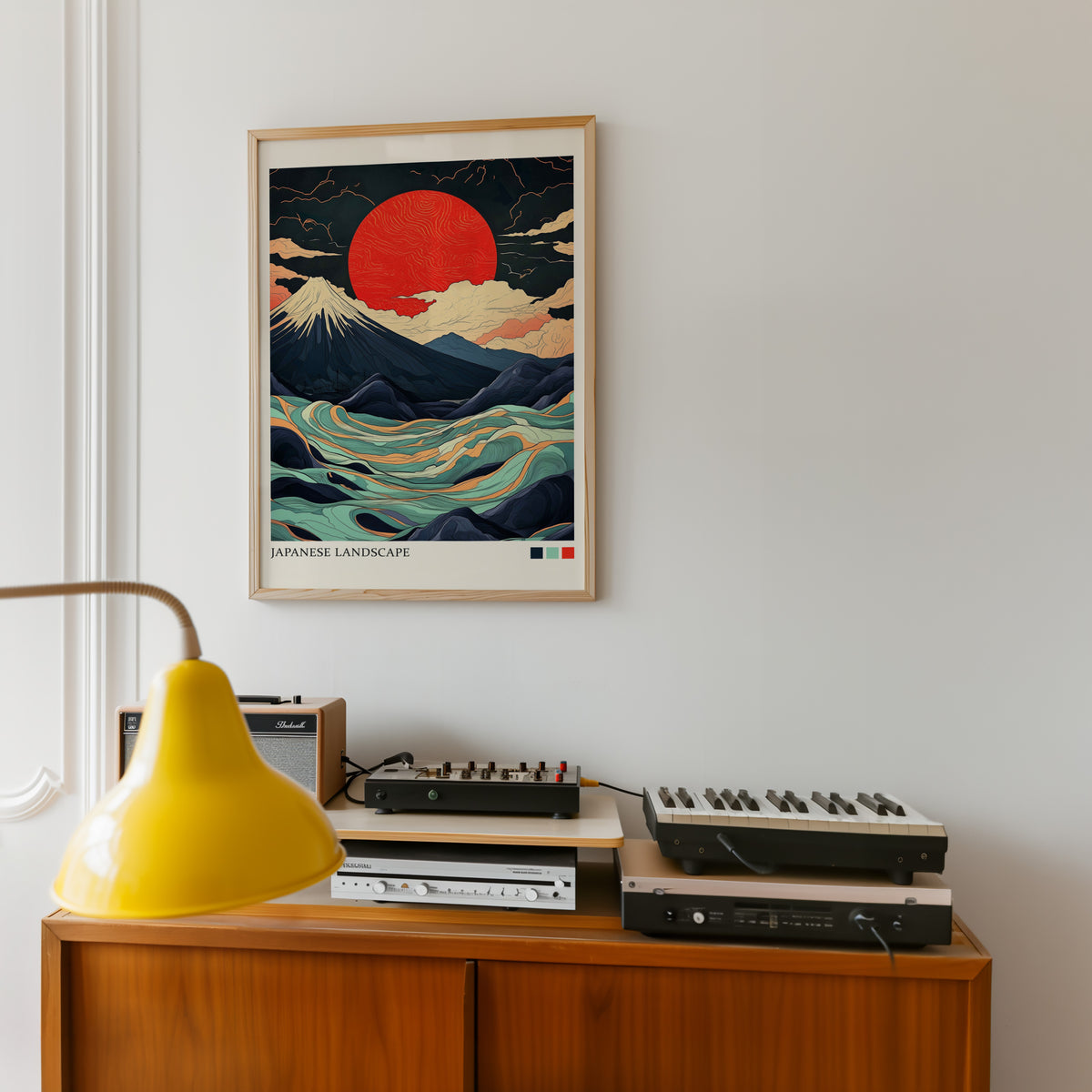 Fuji teal waves red sun print in an oak frame above a teak sideboard with vintage hi-fi