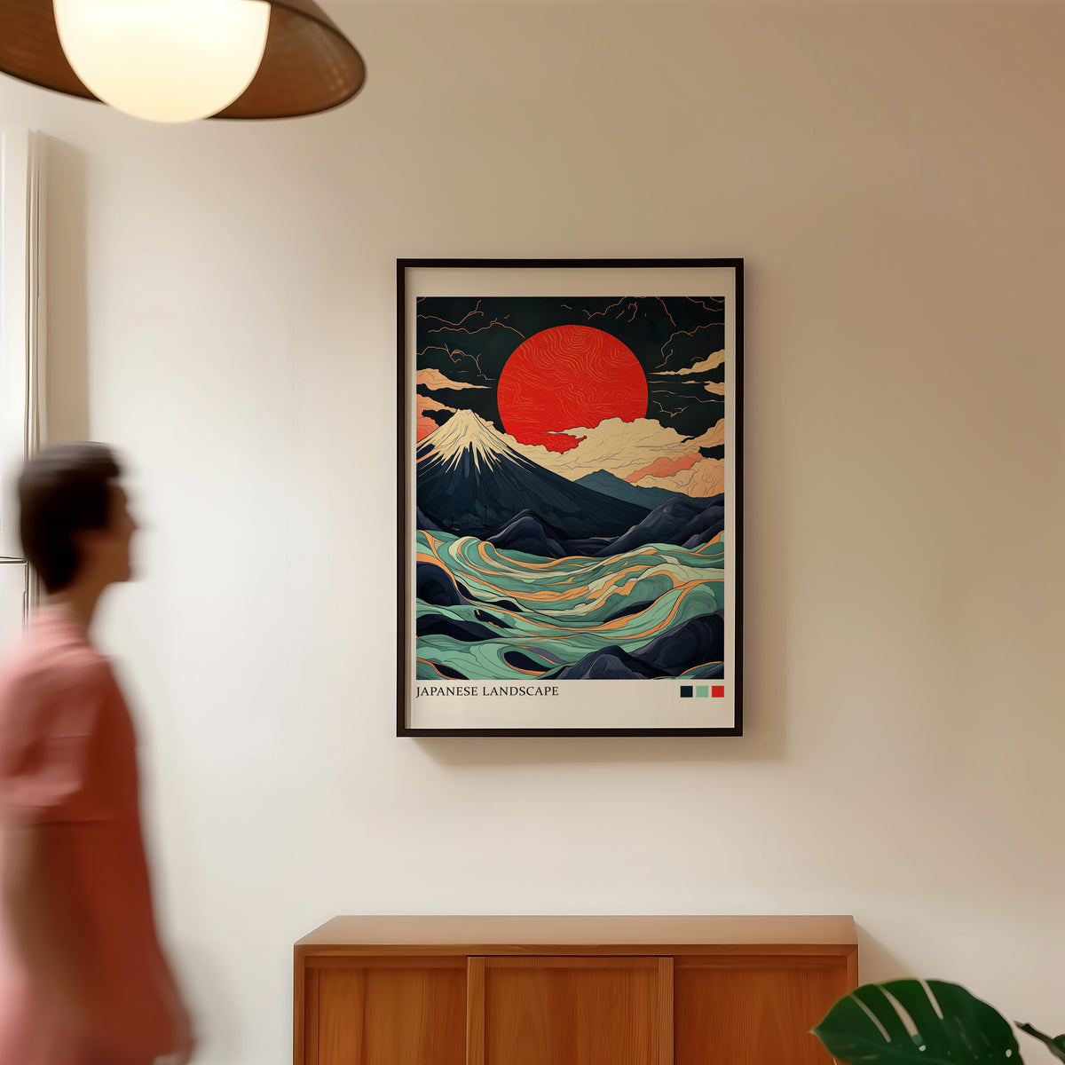 Fuji teal waves red sun print in a black frame in a hallway under a rattan pendant