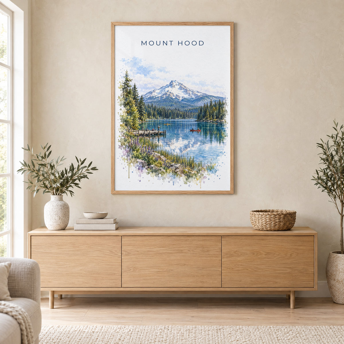 Mount Hood watercolor print in an oak frame above a light wood sideboard in a Scandinavian living room
