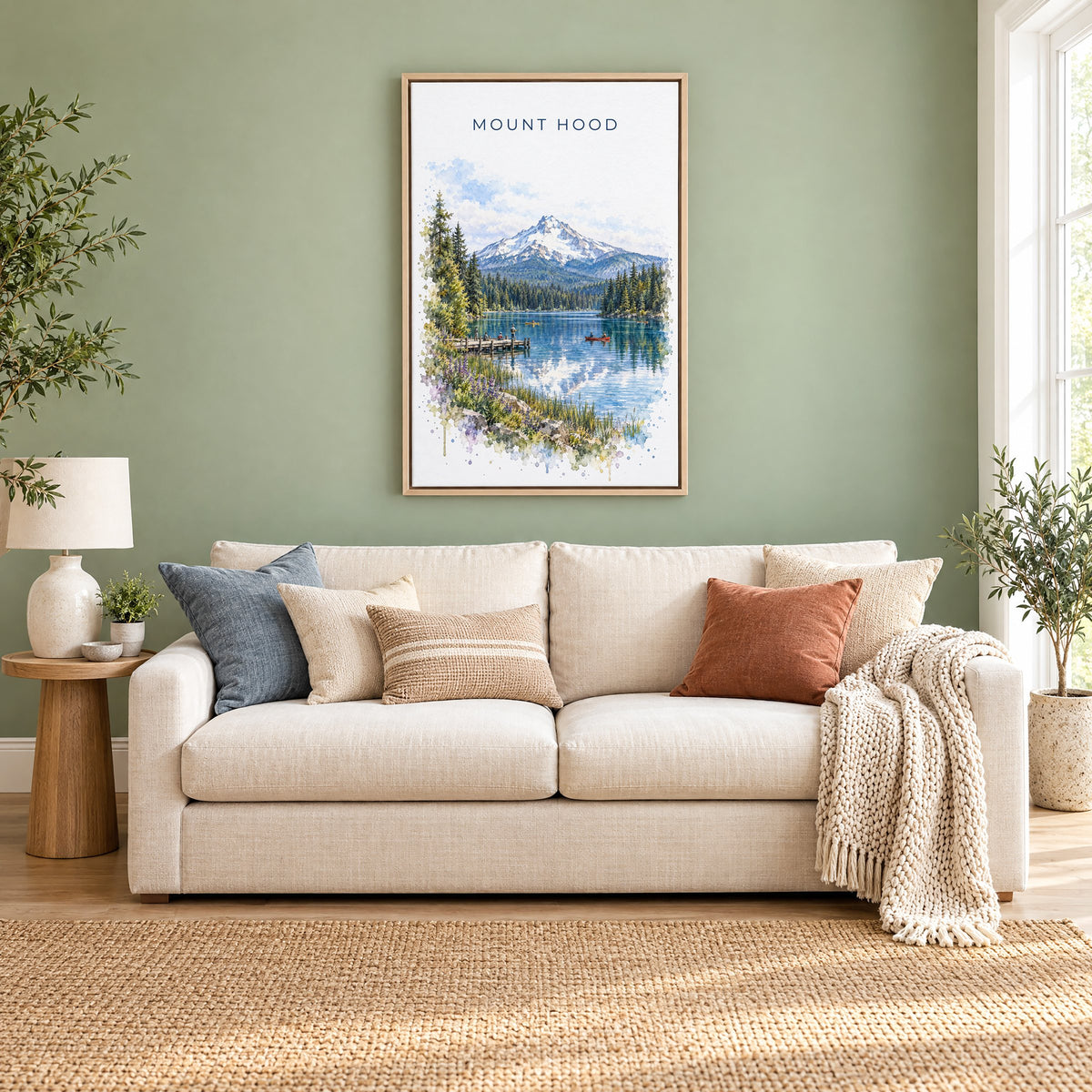 Mount Hood watercolor print as a natural floater canvas above a cream linen sofa on a sage green wall