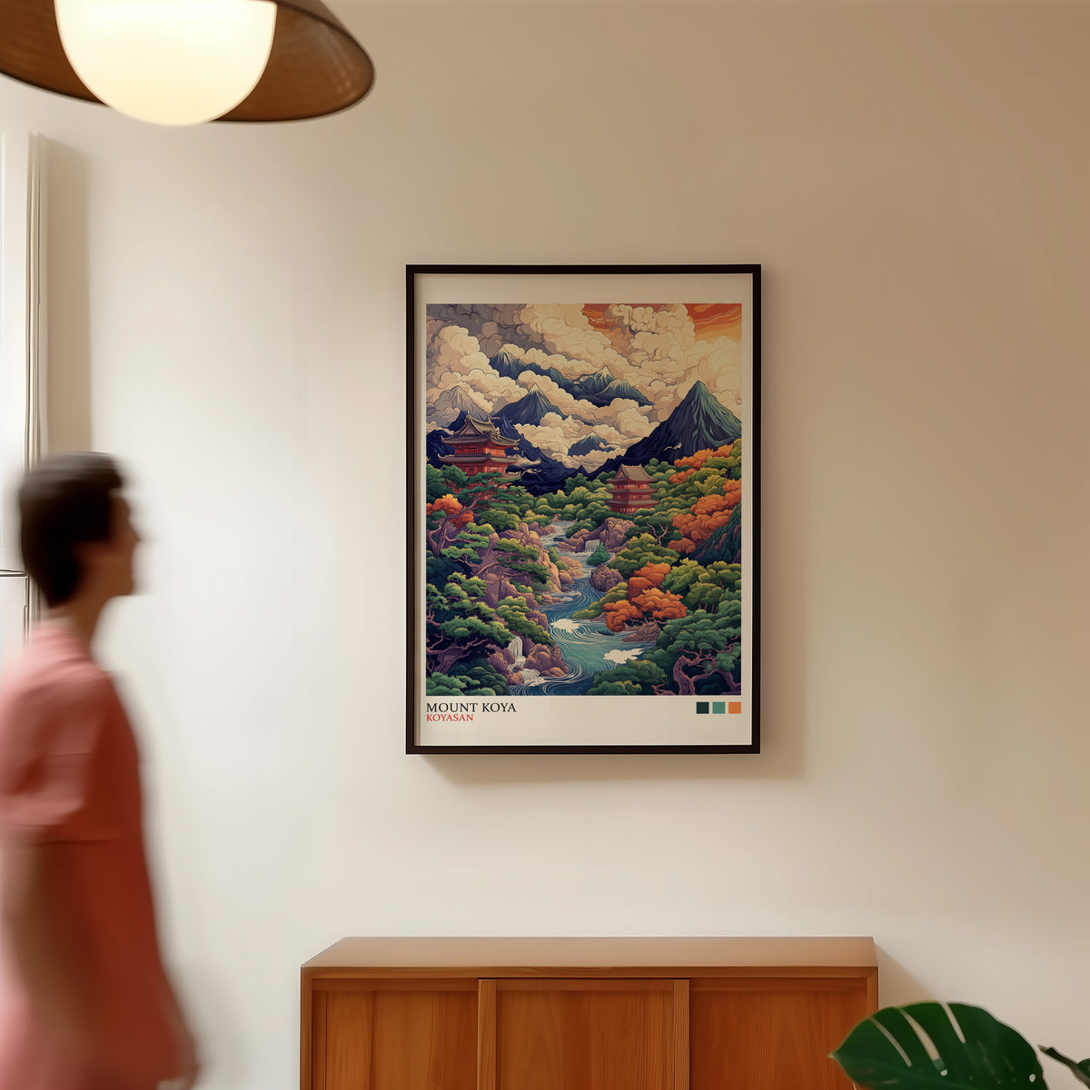 Mount Koya red temple ukiyo-e print in a black frame in a hallway under a rattan pendant