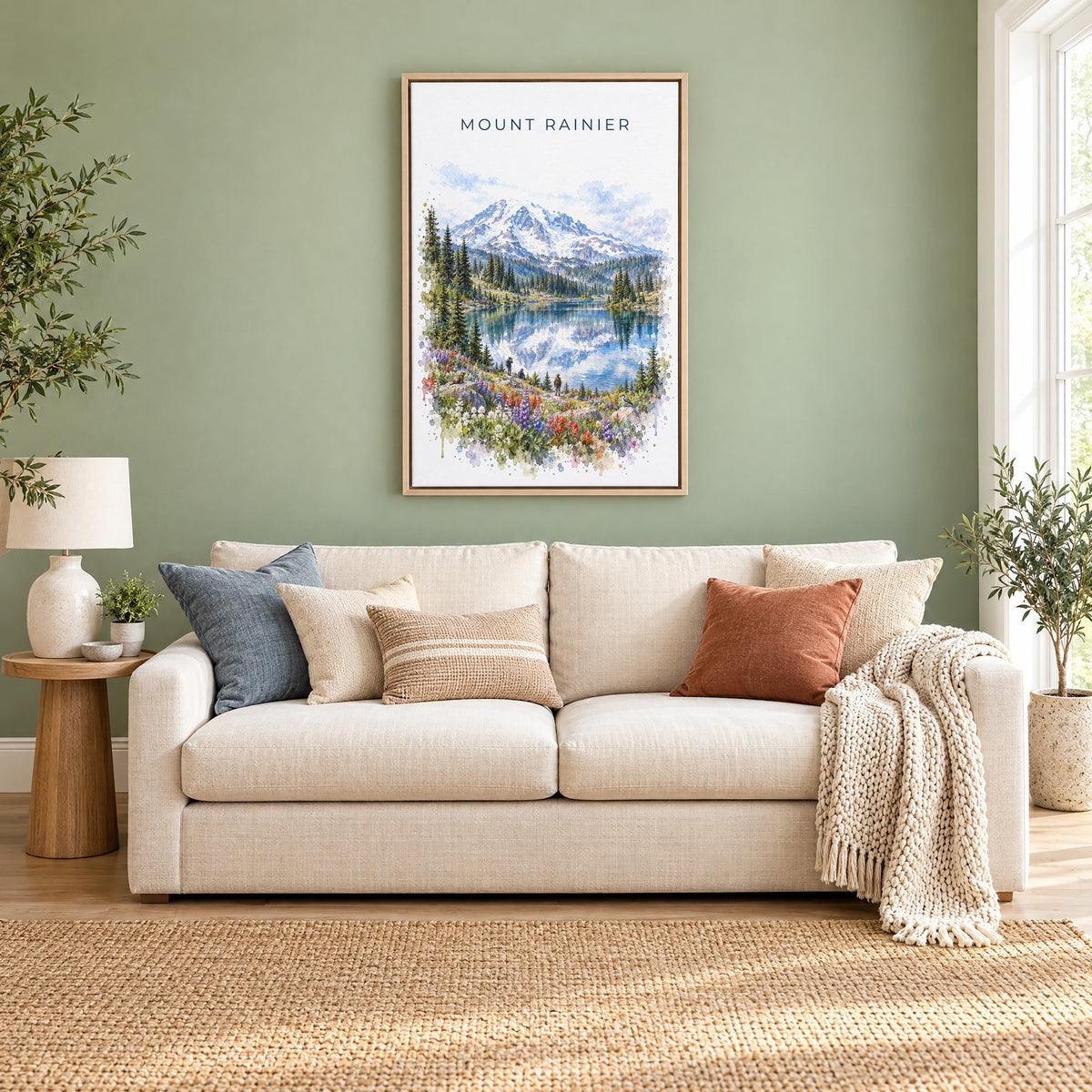 Mount Rainier National Park watercolor print as a natural floater canvas above a cream linen sofa on a sage green wall