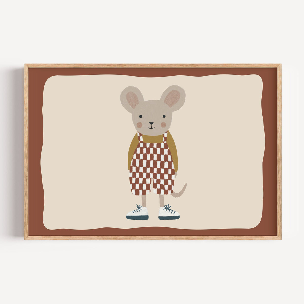 Landscape mouse checkered overalls nursery print in a light oak frame on a plain white wall