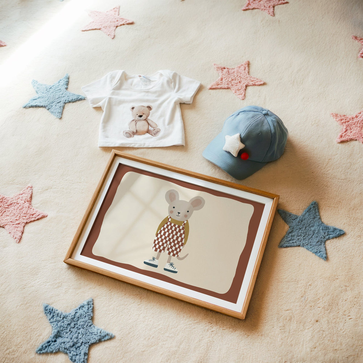 Landscape mouse checkered overalls nursery print in a matted oak frame on a star rug with a baby tee