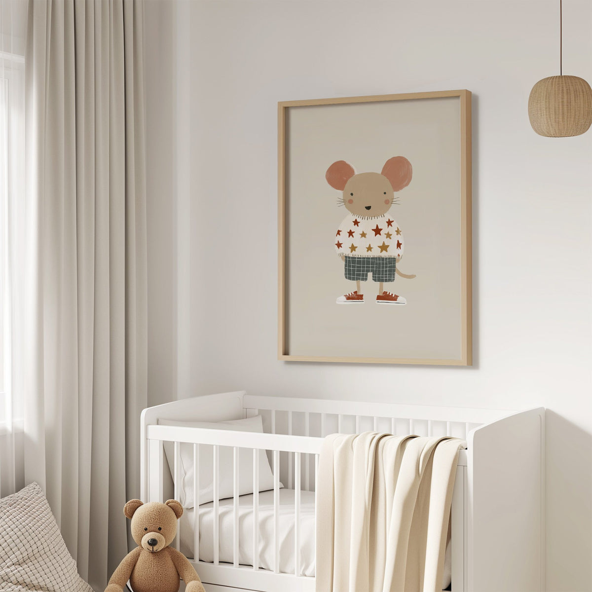 Mouse star sweater plaid shorts nursery print in an oak frame above a white crib with a teddy bear