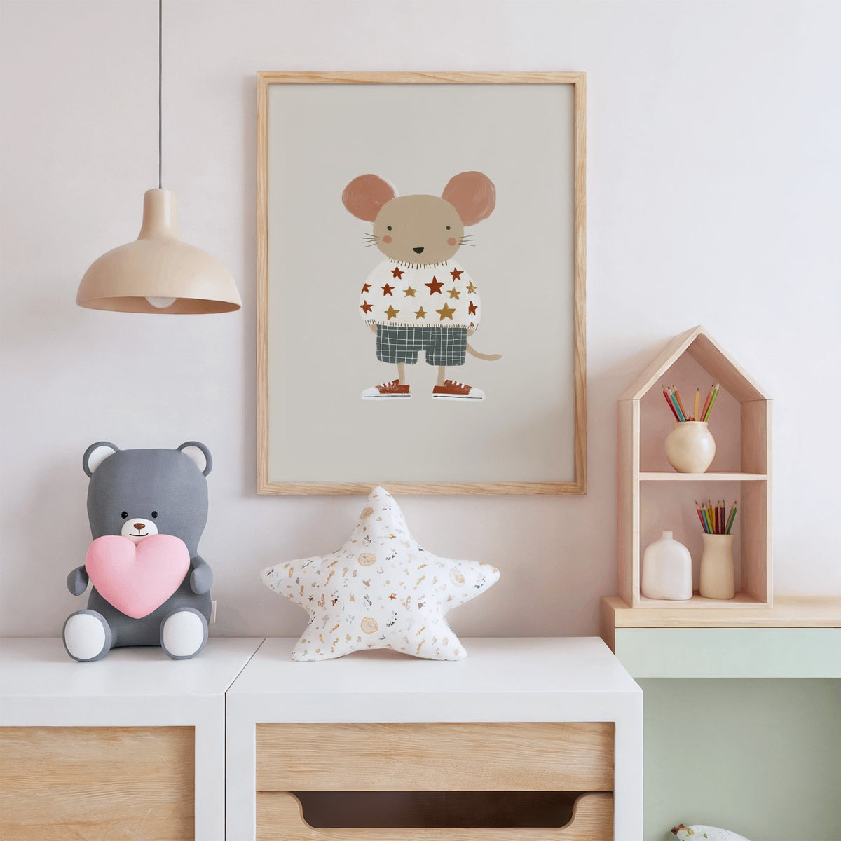 Mouse star sweater plaid shorts nursery print in an oak frame above a white dresser with a star pillow and house shelf