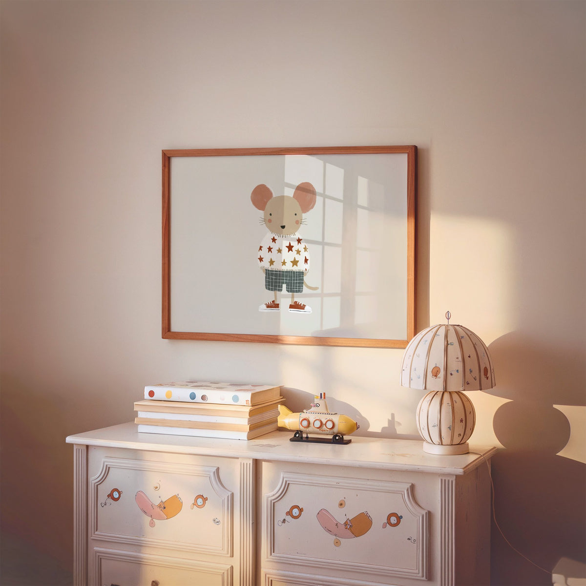 Landscape mouse star sweater plaid shorts nursery print in a cherry wood frame above a painted dresser and lamp