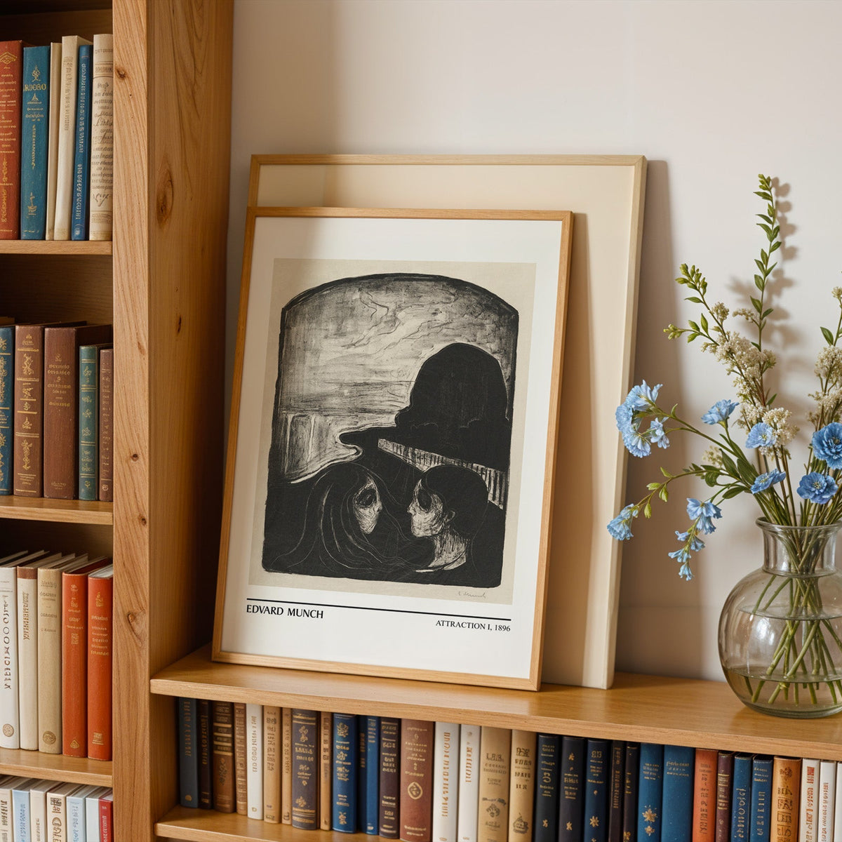 Munch lithograph in an oak frame leaning on a bookshelf beside blue flowers
