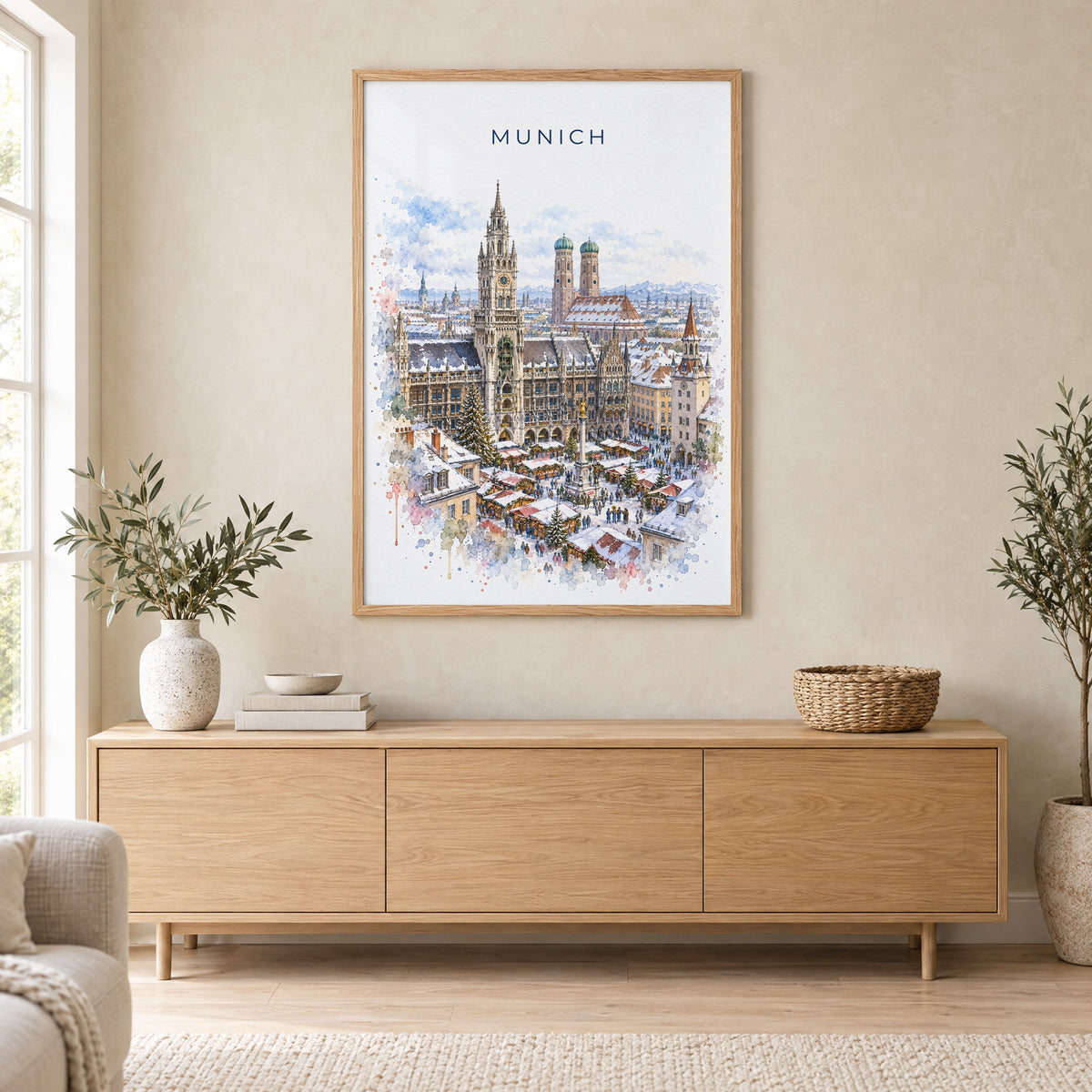 Munich watercolor print in an oak frame above a light wood sideboard in a Scandinavian living room