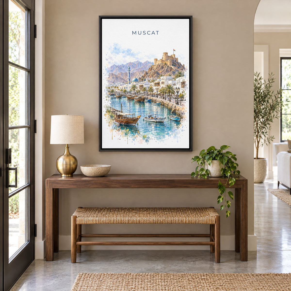 Muscat watercolor print as a black floater canvas above a walnut console and woven bench in an entryway