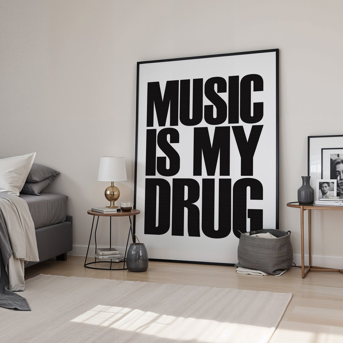 Music Is My Drug black lettering on white print in a black frame leaning in a bedroom beside a gold lamp