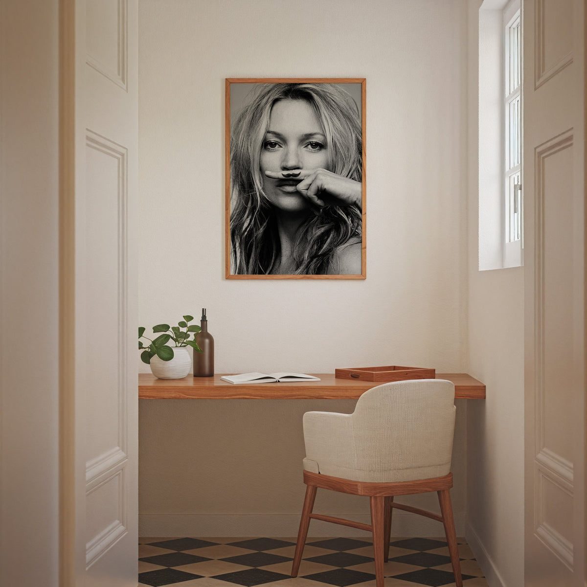 Close portrait with finger mustache under nose print in an oak frame above a home office desk nook
