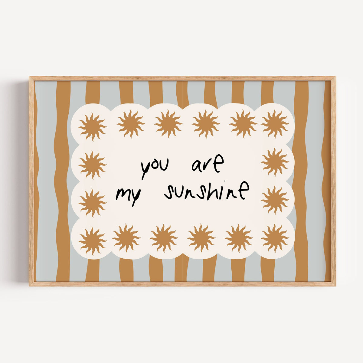 Landscape my sunshine sun border nursery print in a light oak frame on a plain white wall